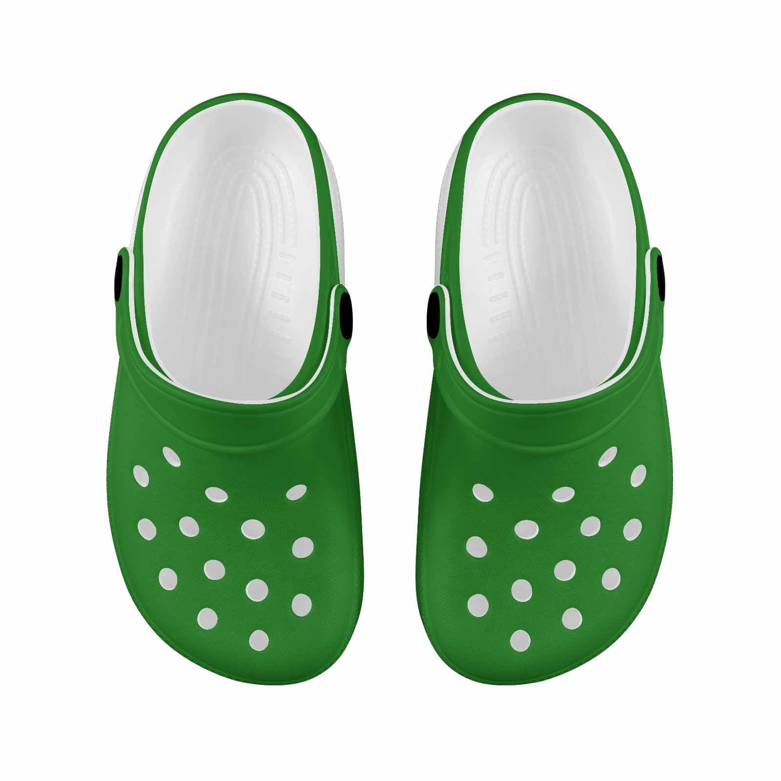 A pair of forest green clogs designed for youth, featuring a slip-on design, ventilation ports, and cushioned soles for comfort.