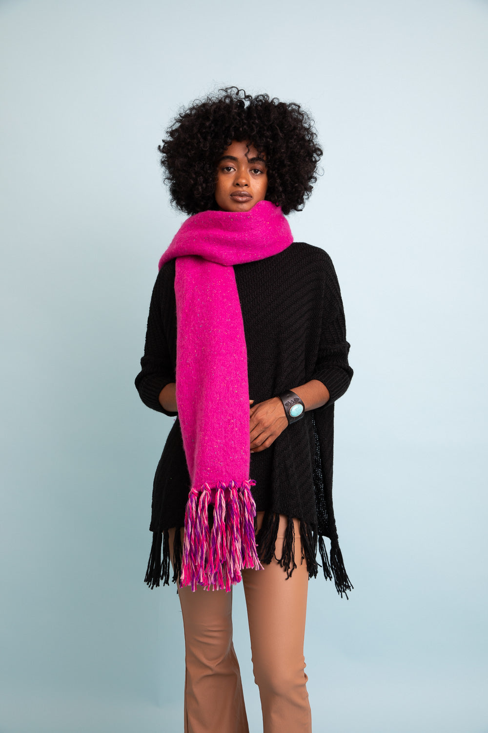 A stylish Frayed Bohemian Flow Scarf with frayed edges, showcasing a soft and lightweight fabric, perfect for chilly days.