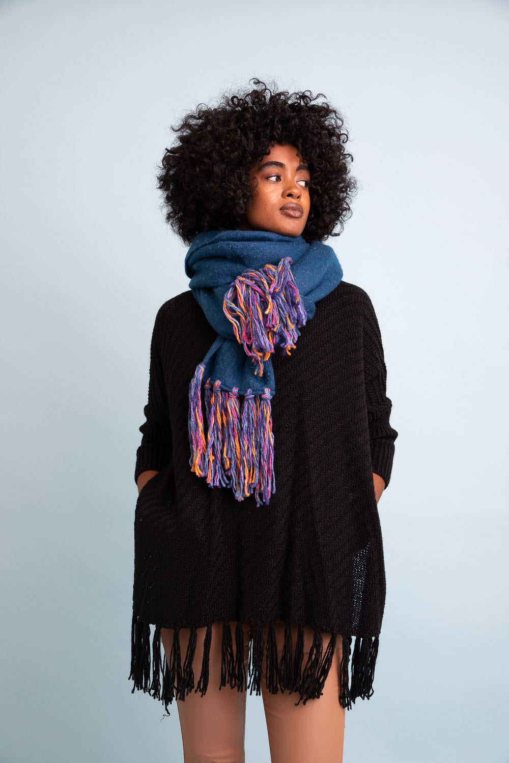 A stylish Frayed Bohemian Flow Scarf with frayed edges, showcasing a soft and lightweight fabric, perfect for chilly days.