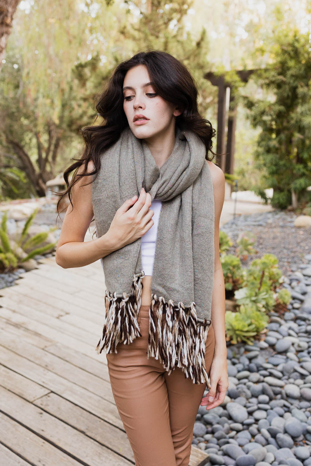 A stylish Frayed Bohemian Flow Scarf with frayed edges, showcasing a soft and lightweight fabric, perfect for chilly days.