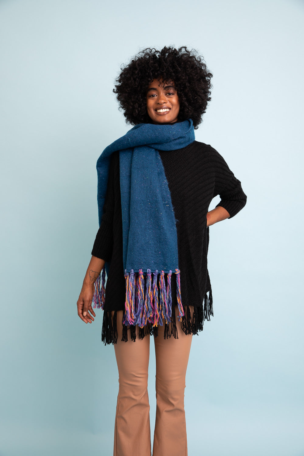 A stylish Frayed Bohemian Flow Scarf with frayed edges, showcasing a soft and lightweight fabric, perfect for chilly days.