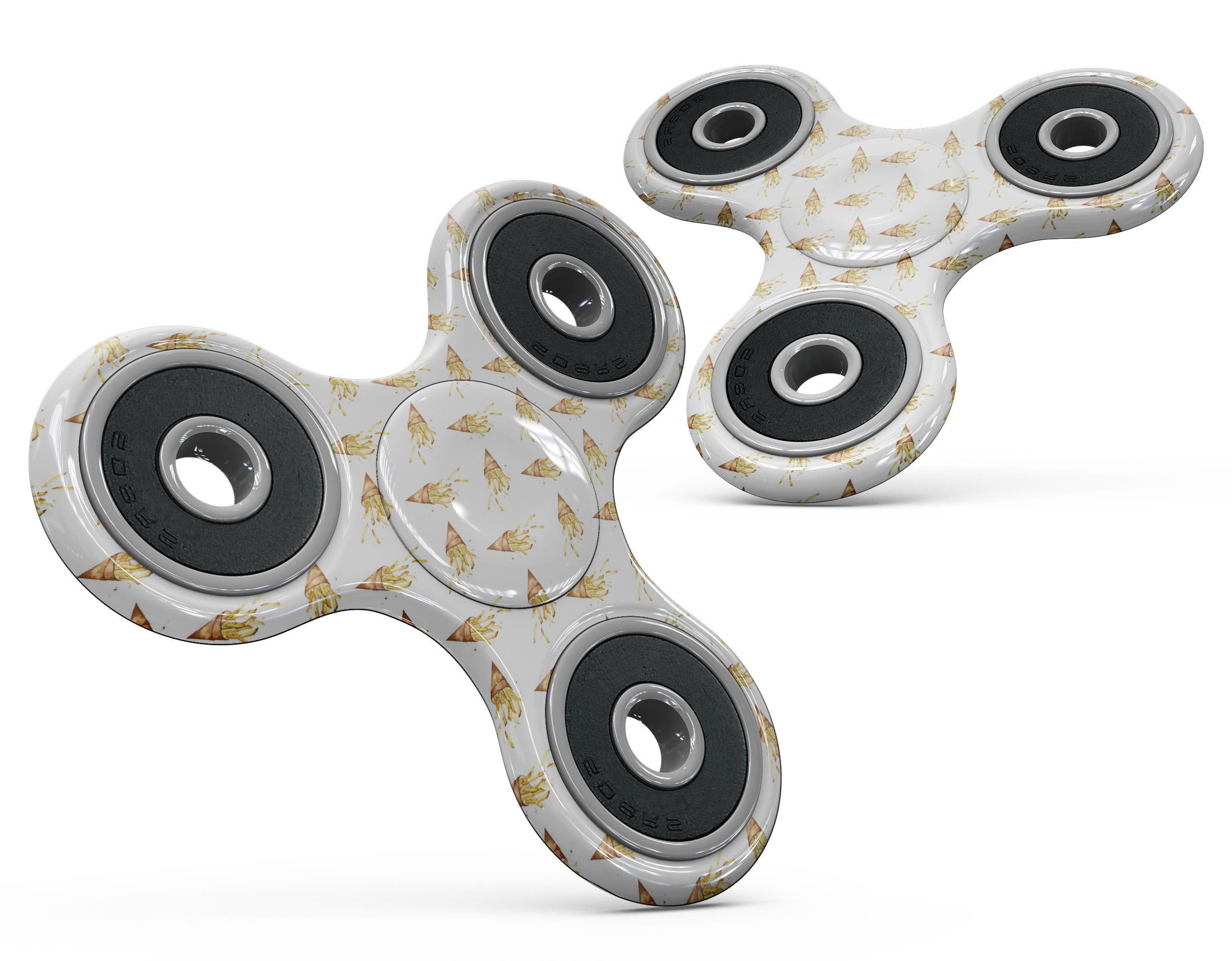 A colorful fidget spinner skin featuring a playful French fries design, showcasing vibrant colors and a unique pattern.