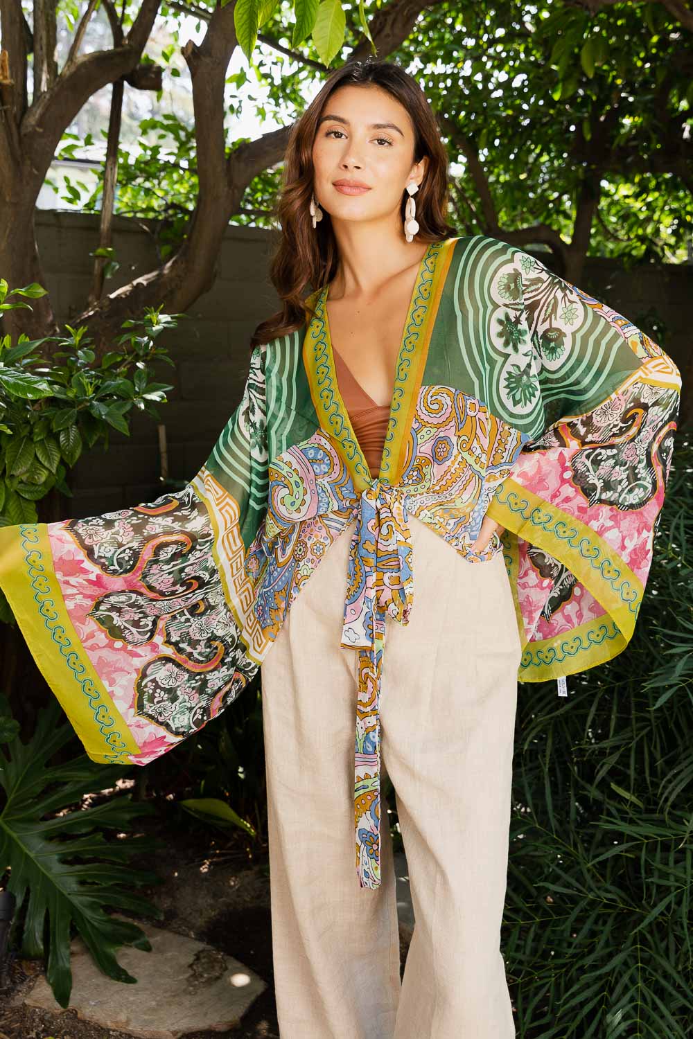 Free Spirit Boho Tie Front Wrap featuring adjustable tie front and armholes, showcasing a flowing design in a stylish bohemian style.