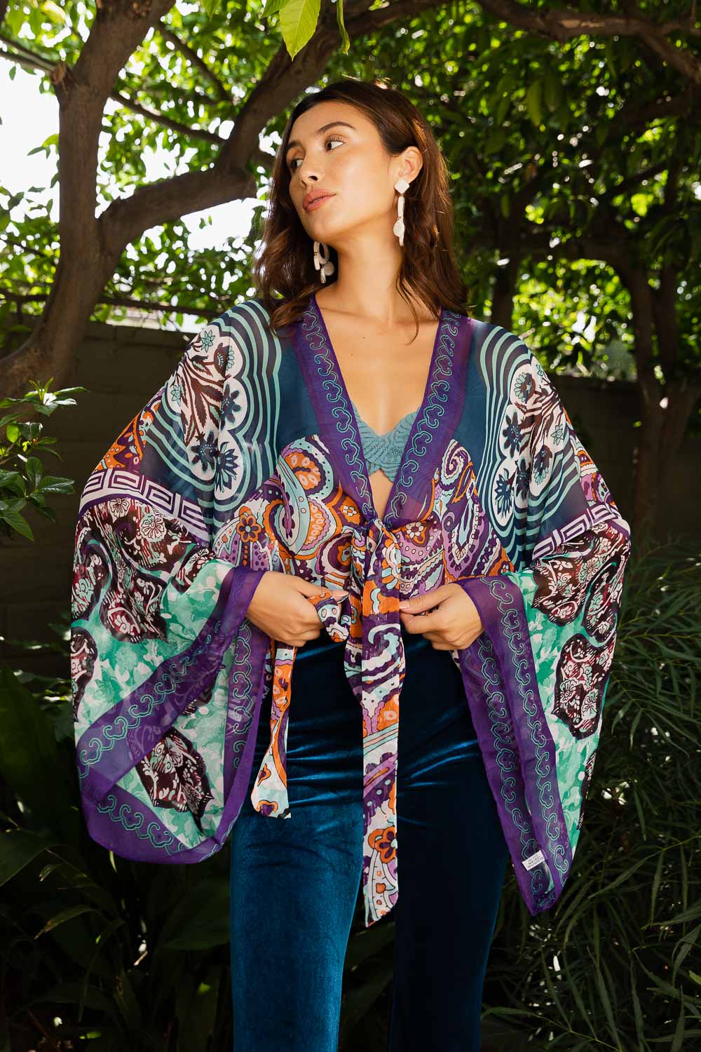 Free Spirit Boho Tie Front Wrap featuring adjustable tie front and armholes, showcasing a flowing design in a stylish bohemian style.