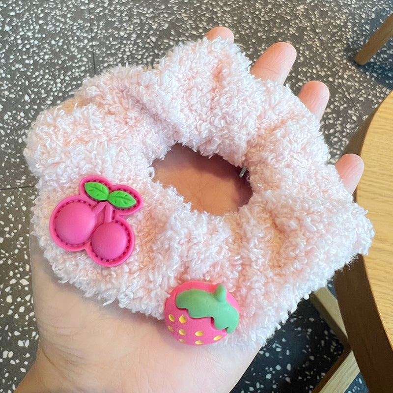 A set of four vibrant fruit color hair scrunchies featuring a stylish heart design, perfect for adding a playful touch to any hairstyle.