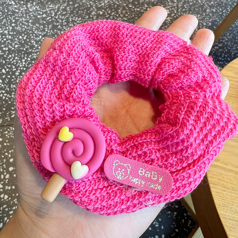 A set of four vibrant fruit color hair scrunchies featuring a stylish heart design, perfect for adding a playful touch to any hairstyle.