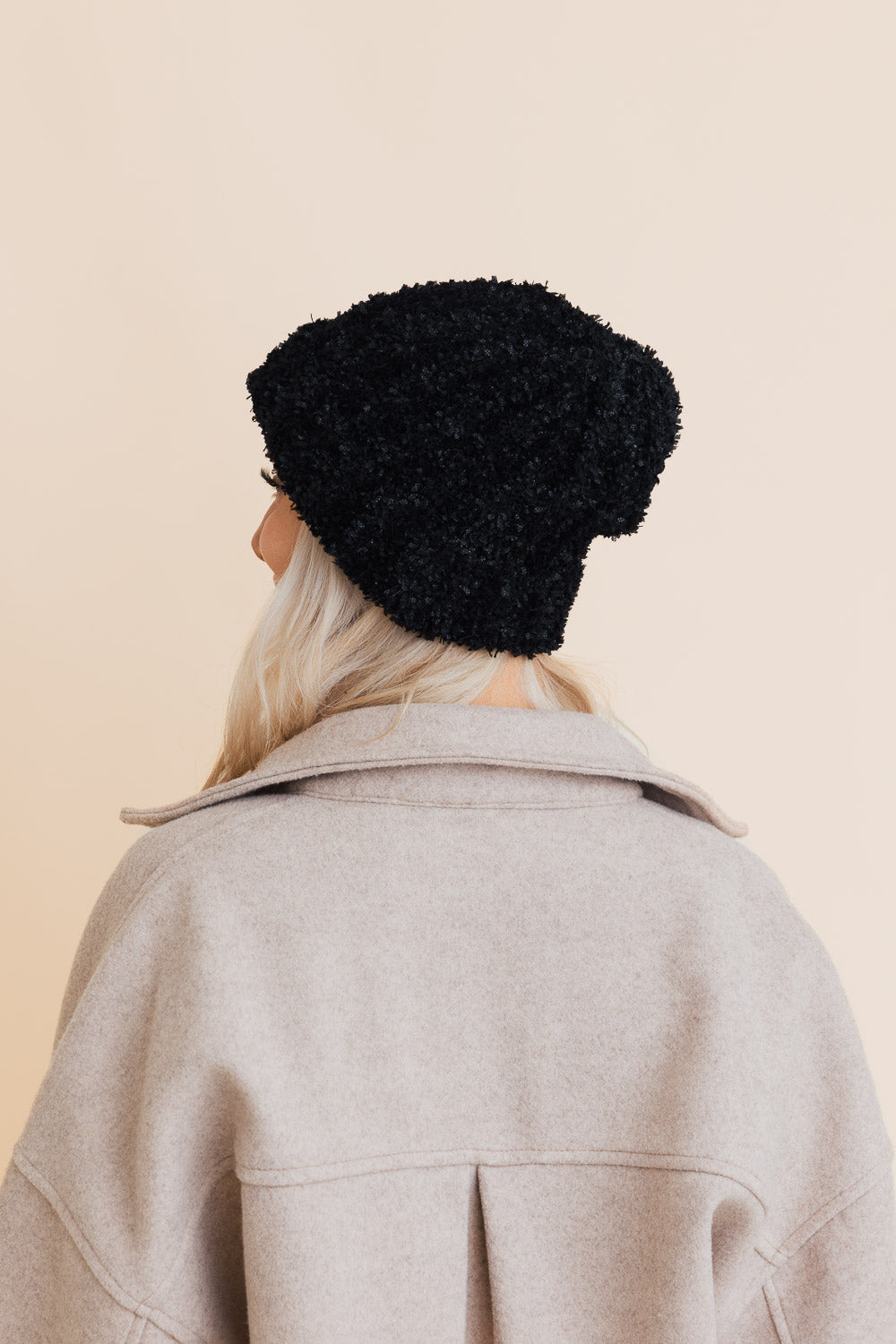 A cozy Fuzzy Fluff Toast Beanie made from soft chenille, perfect for winter wear, showcasing its luxurious texture and stylish design.