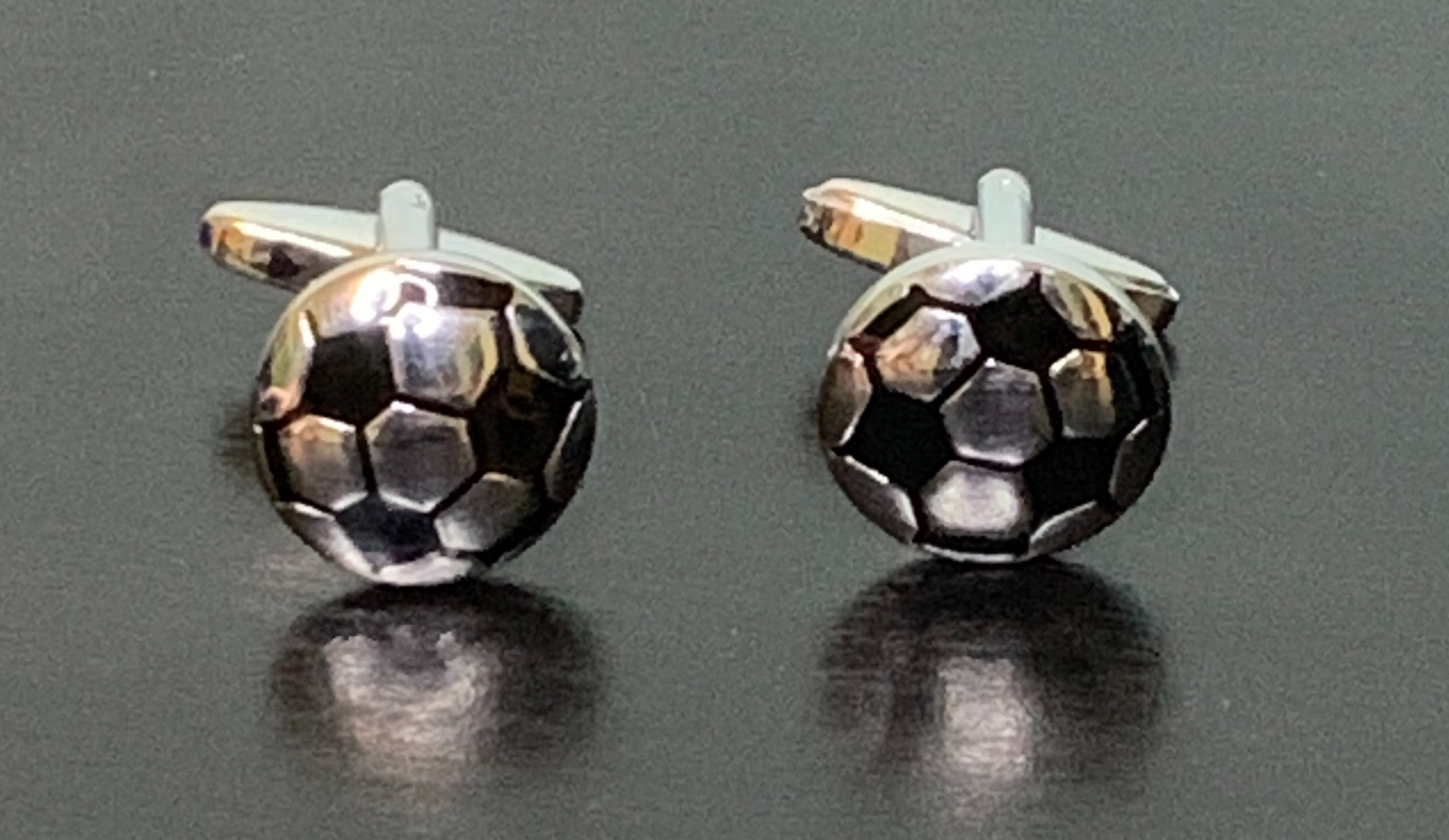 Elegant Gentleman's Game Cufflinks featuring a football design, perfect for stylish gentlemen.