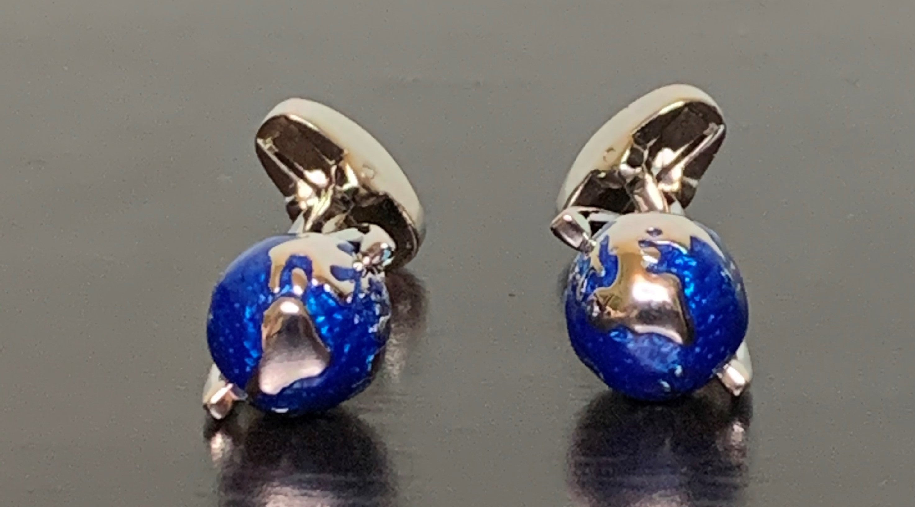 A pair of elegant Gentleman's World Cufflinks showcasing a global design, perfect for refined gentlemen.