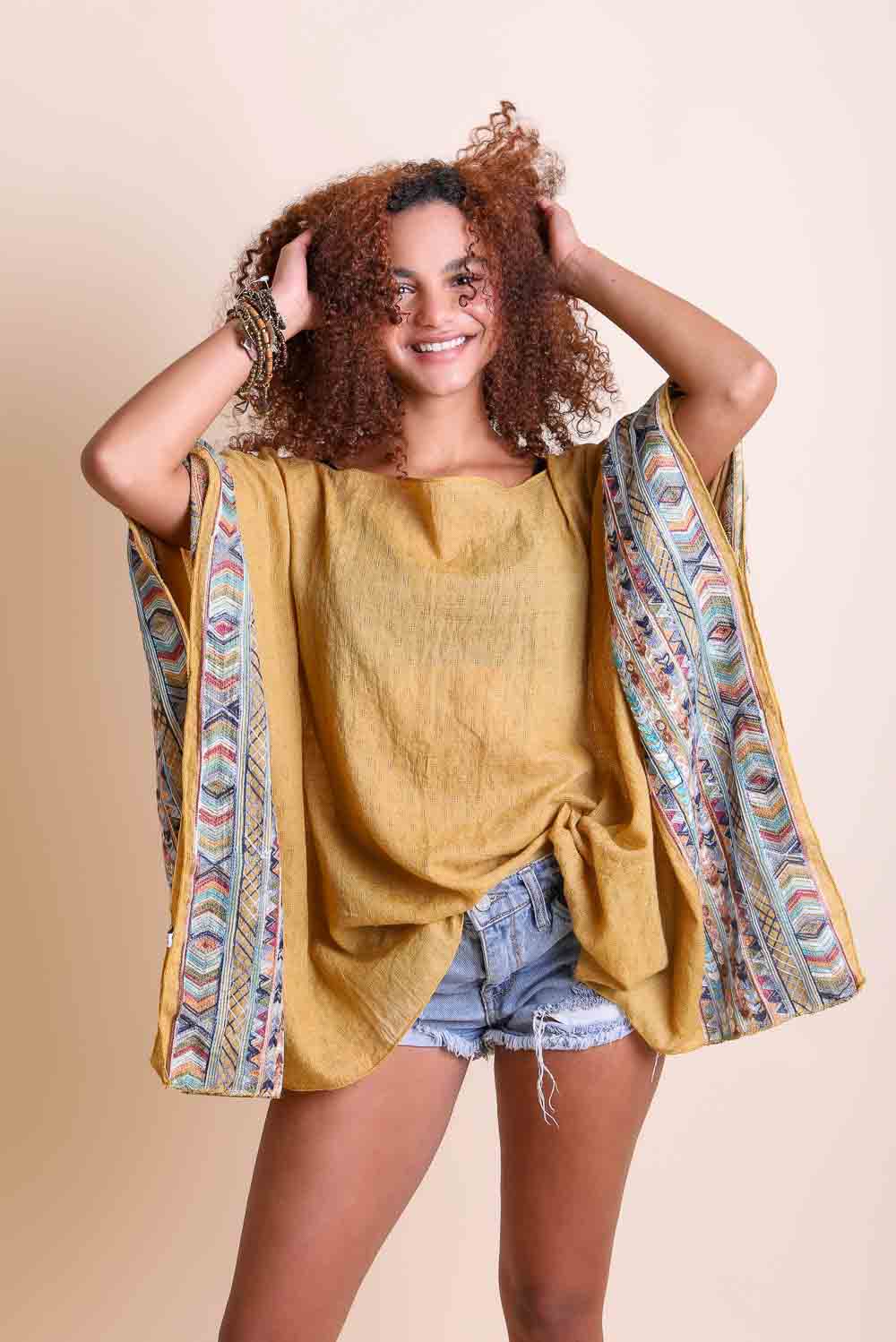 Geometric Embroidered Tunic featuring intricate patterns, perfect for layering or beach cover-ups.