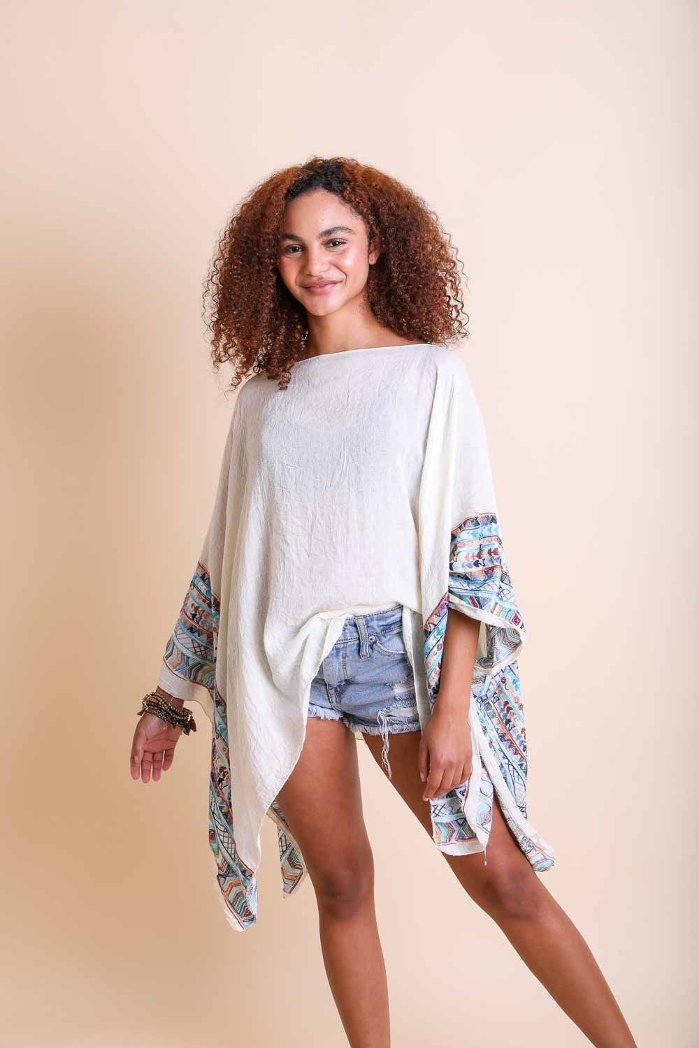 Geometric Embroidered Tunic featuring intricate patterns, perfect for layering or beach cover-ups.