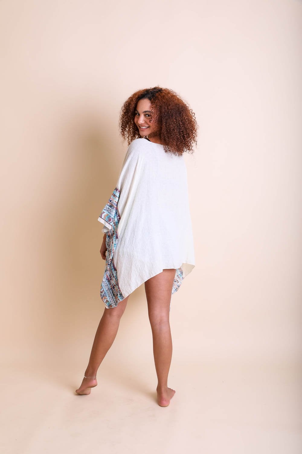 Geometric Embroidered Tunic featuring intricate patterns, perfect for layering or beach cover-ups.