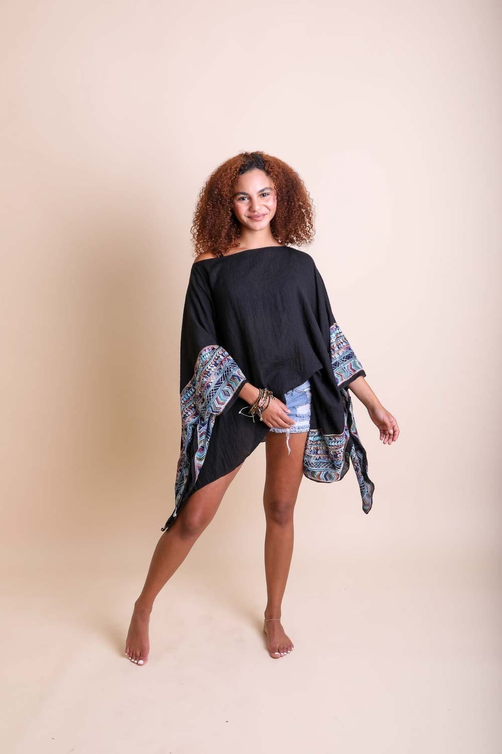 Geometric Embroidered Tunic featuring intricate patterns, perfect for layering or beach cover-ups.