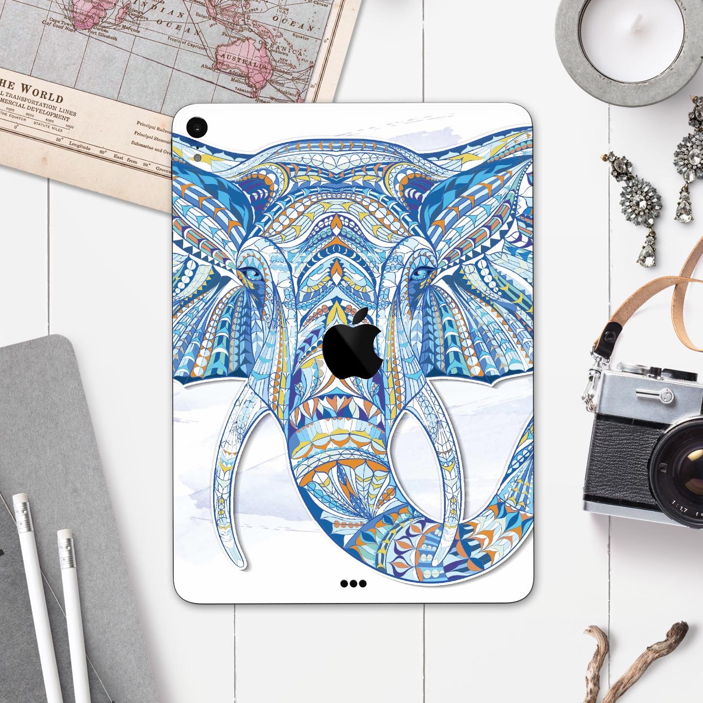 Geometric Sacred Elephant skin decal for Apple iPad, showcasing vibrant colors and intricate design on a sleek surface.