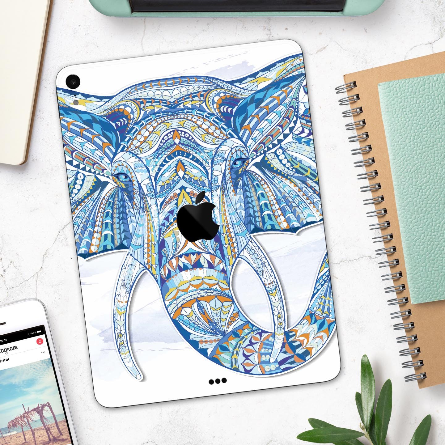 Geometric Sacred Elephant skin decal for Apple iPad, showcasing vibrant colors and intricate design on a sleek surface.