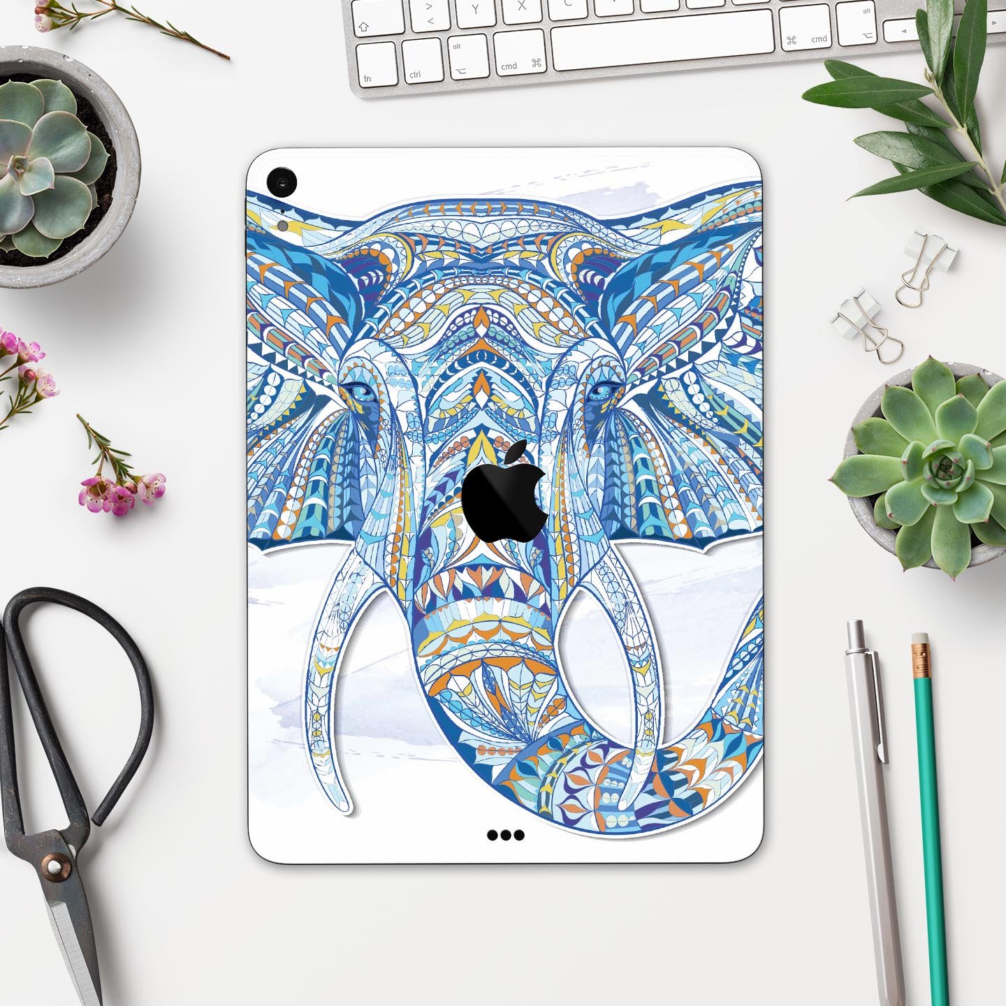 Geometric Sacred Elephant skin decal for Apple iPad, showcasing vibrant colors and intricate design on a sleek surface.