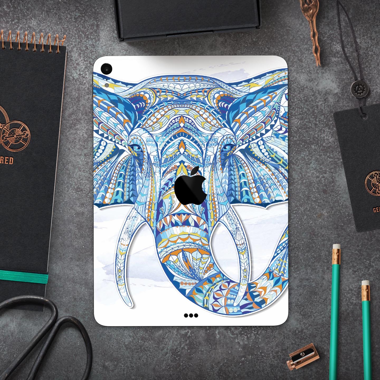 Geometric Sacred Elephant skin decal for Apple iPad, showcasing vibrant colors and intricate design on a sleek surface.