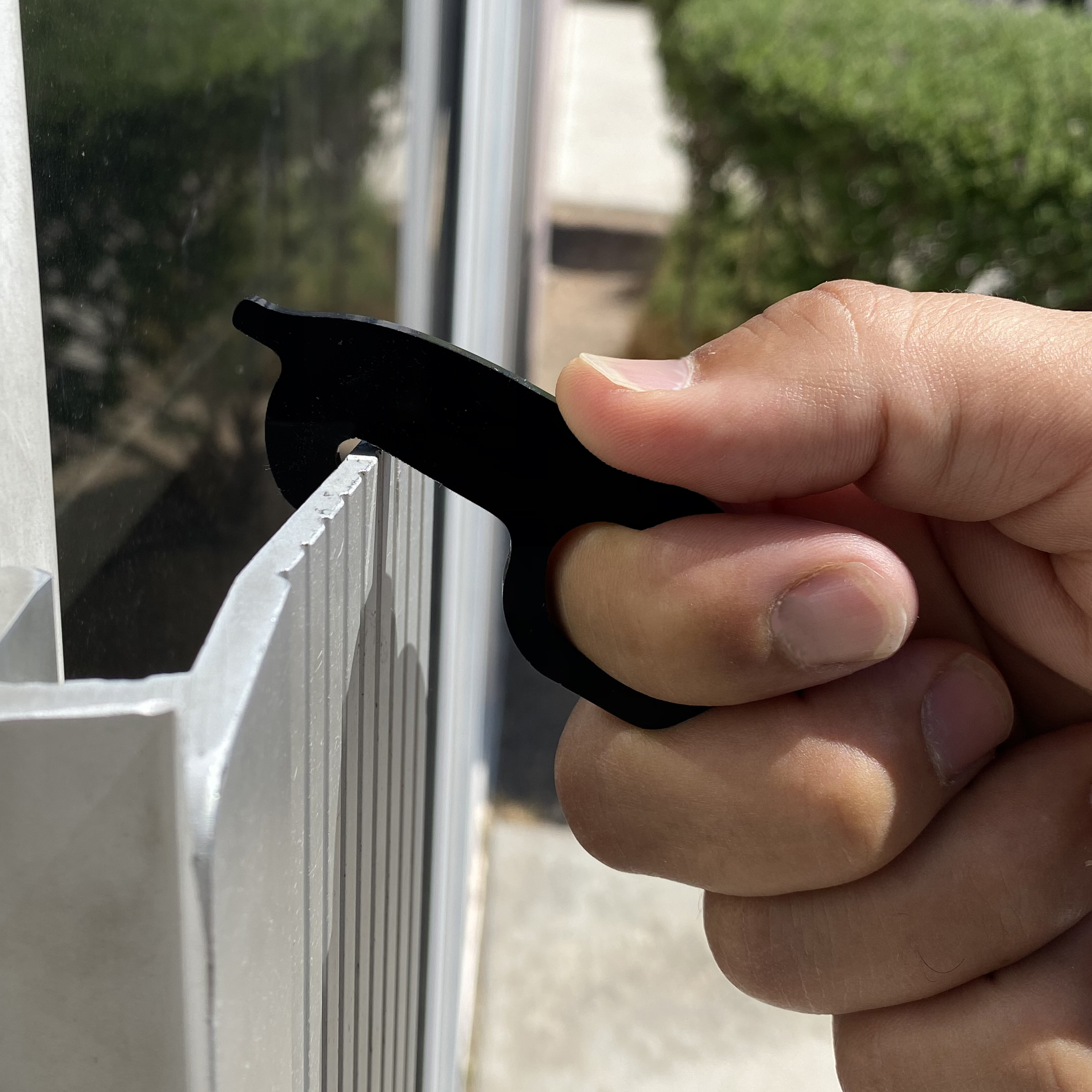 A Germ-Free Key designed for touchless interaction with surfaces, featuring a sleek and ergonomic design for easy handling.