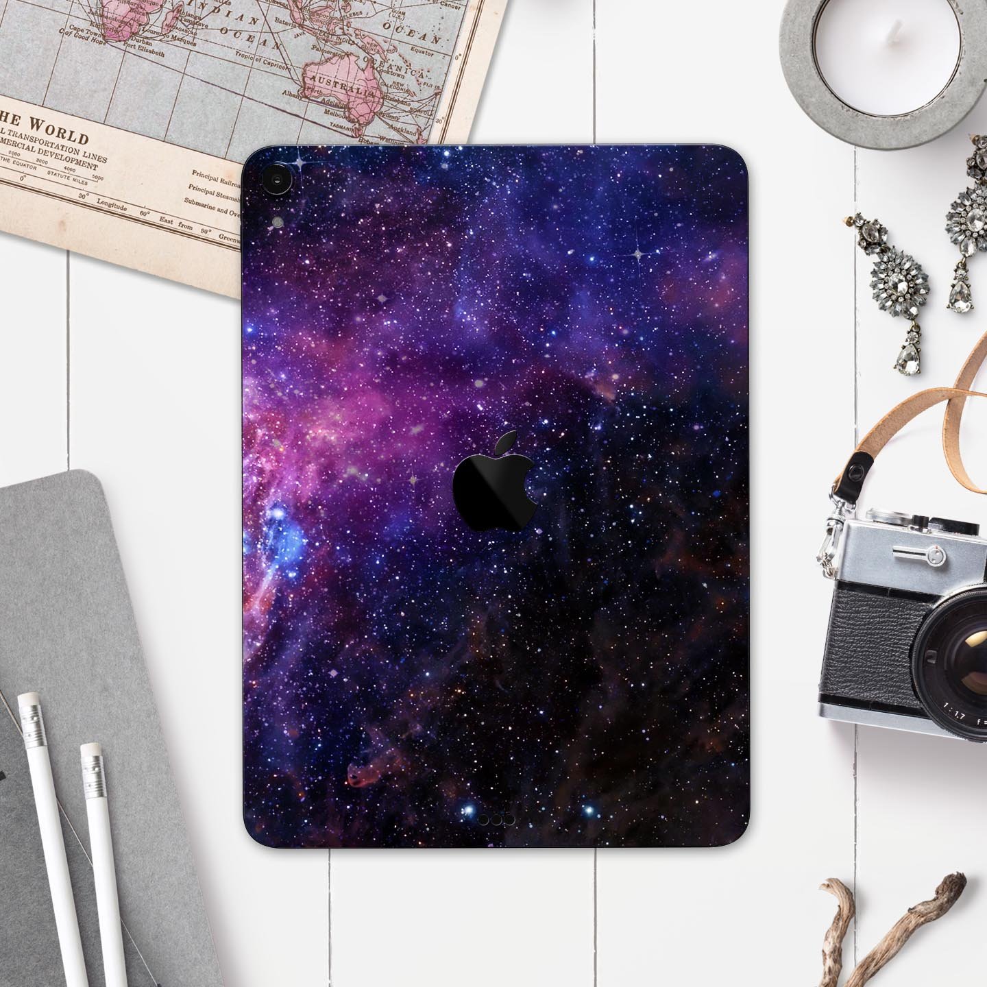 Glowing Deep Space skin decal for Apple iPad Pro, showcasing vibrant cosmic design and ultra-thin protection.