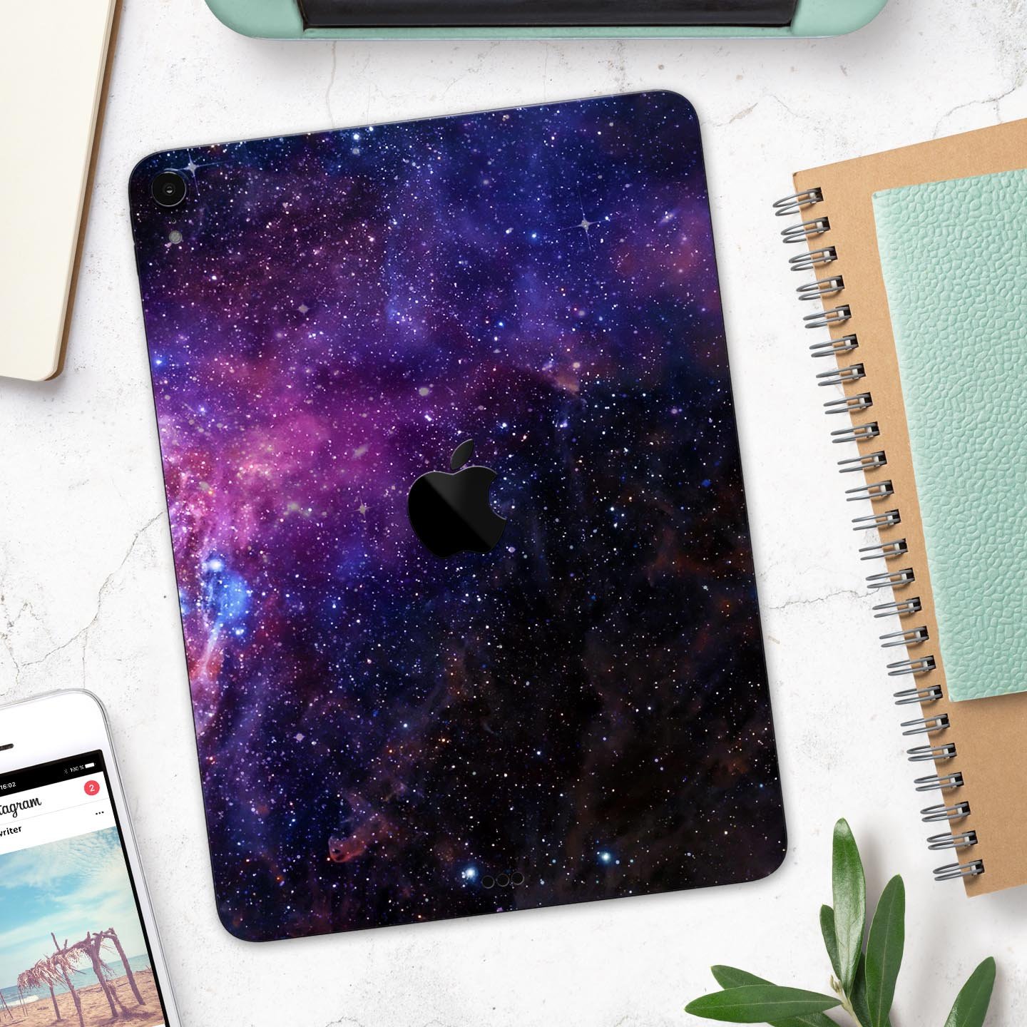 Glowing Deep Space skin decal for Apple iPad Pro, showcasing vibrant cosmic design and ultra-thin protection.