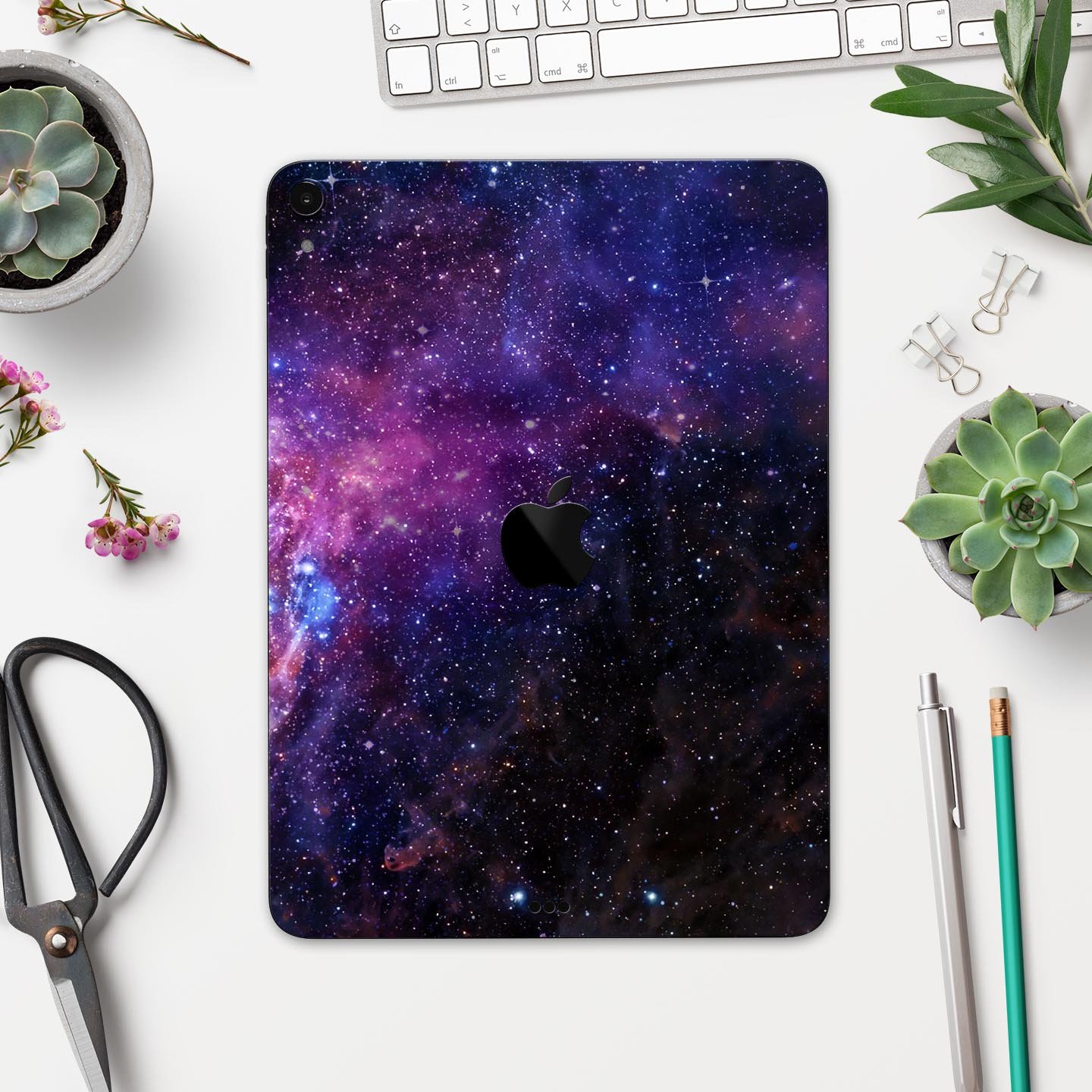 Glowing Deep Space skin decal for Apple iPad Pro, showcasing vibrant cosmic design and ultra-thin protection.