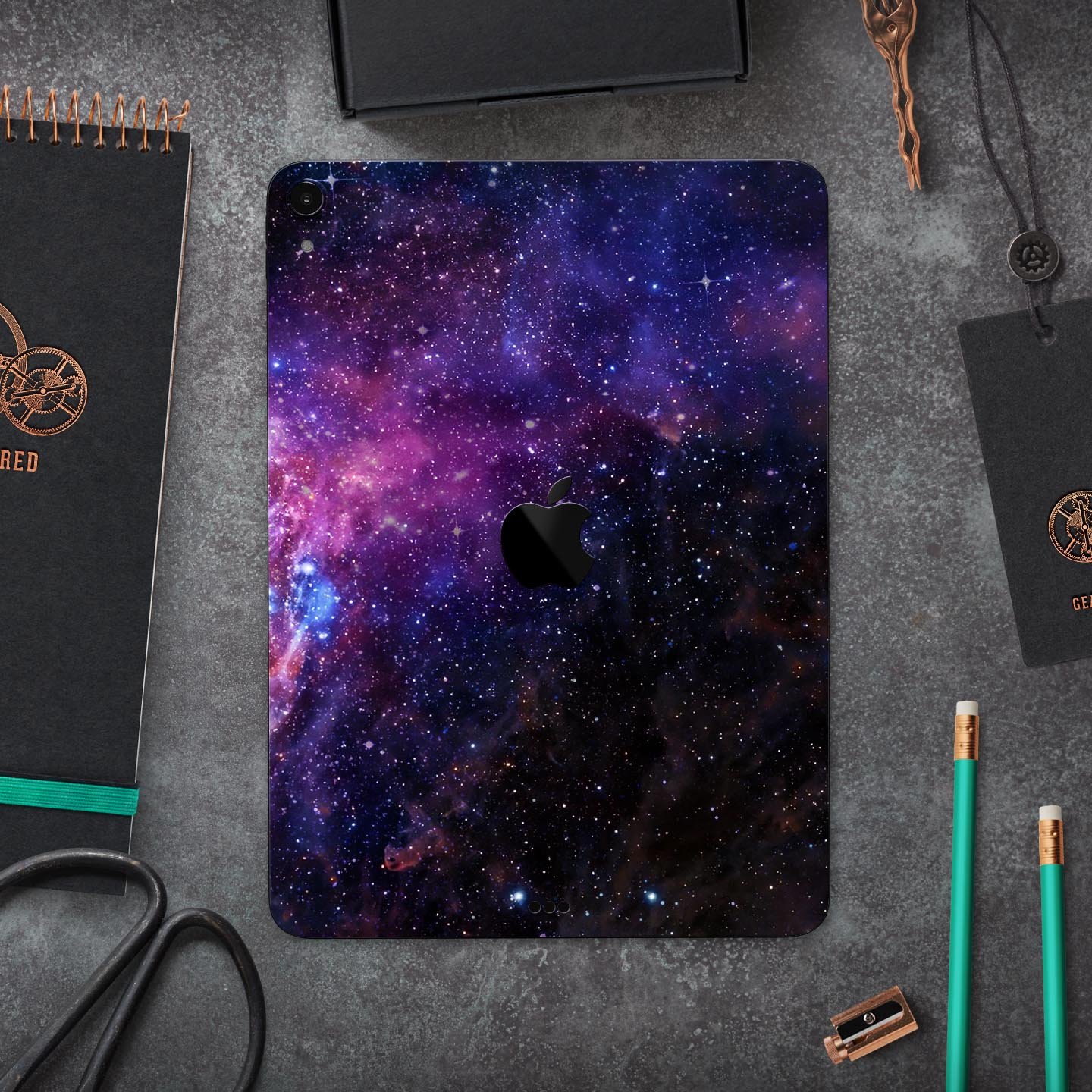 Glowing Deep Space skin decal for Apple iPad Pro, showcasing vibrant cosmic design and ultra-thin protection.