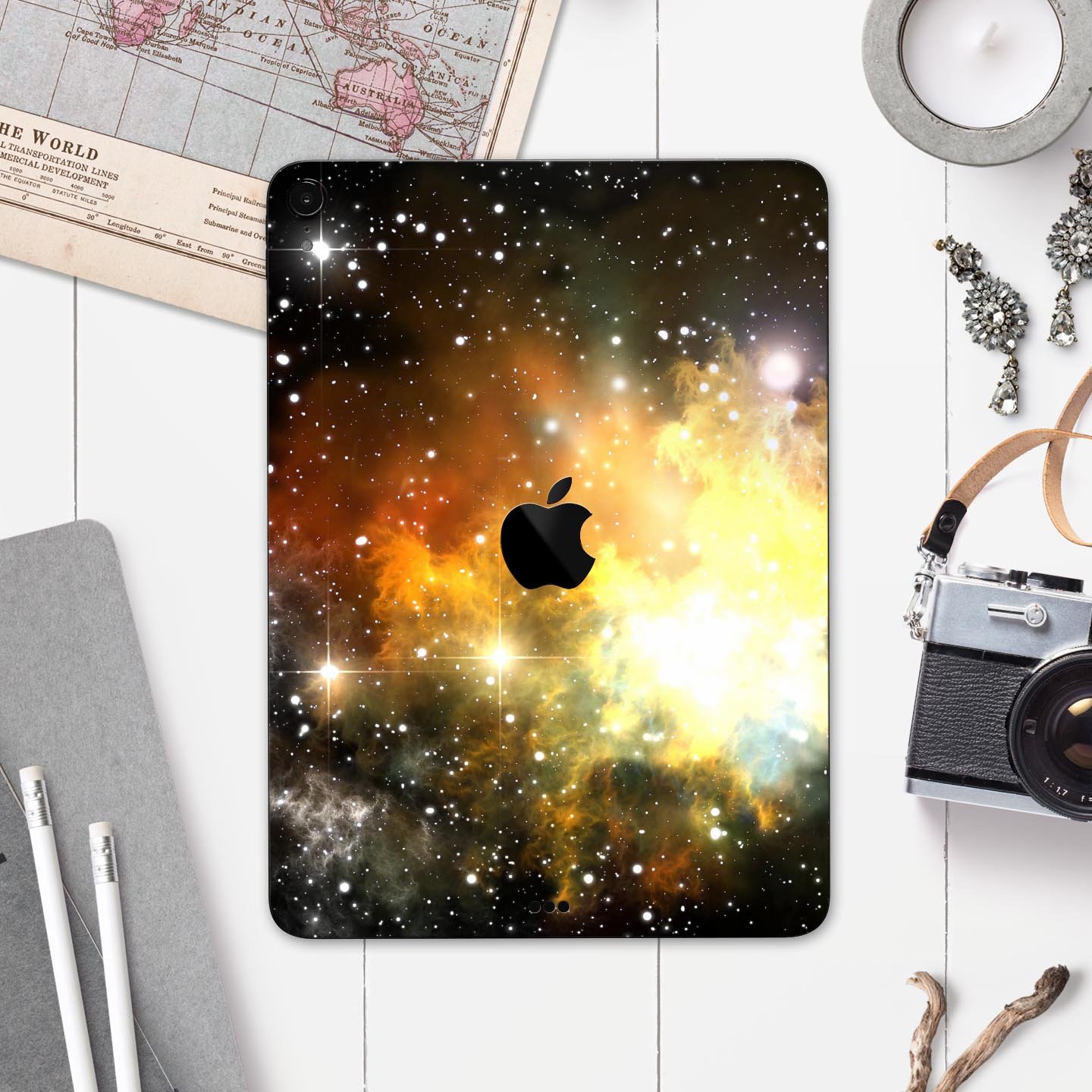 Glowing Gold & Black Nebula skin decal for Apple iPad, showcasing vibrant colors and a sleek design.