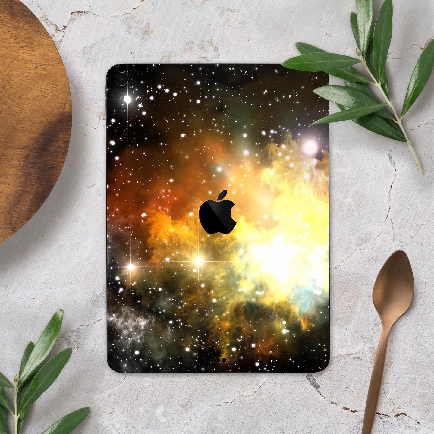 Glowing Gold & Black Nebula skin decal for Apple iPad, showcasing vibrant colors and a sleek design.