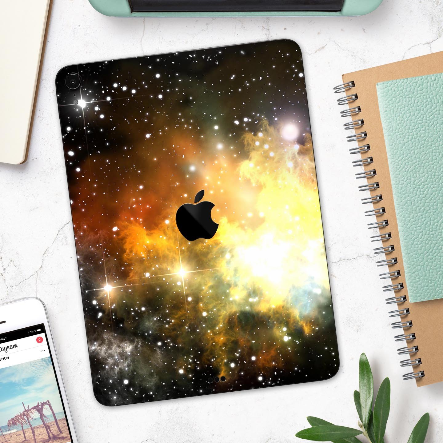 Glowing Gold & Black Nebula skin decal for Apple iPad, showcasing vibrant colors and a sleek design.