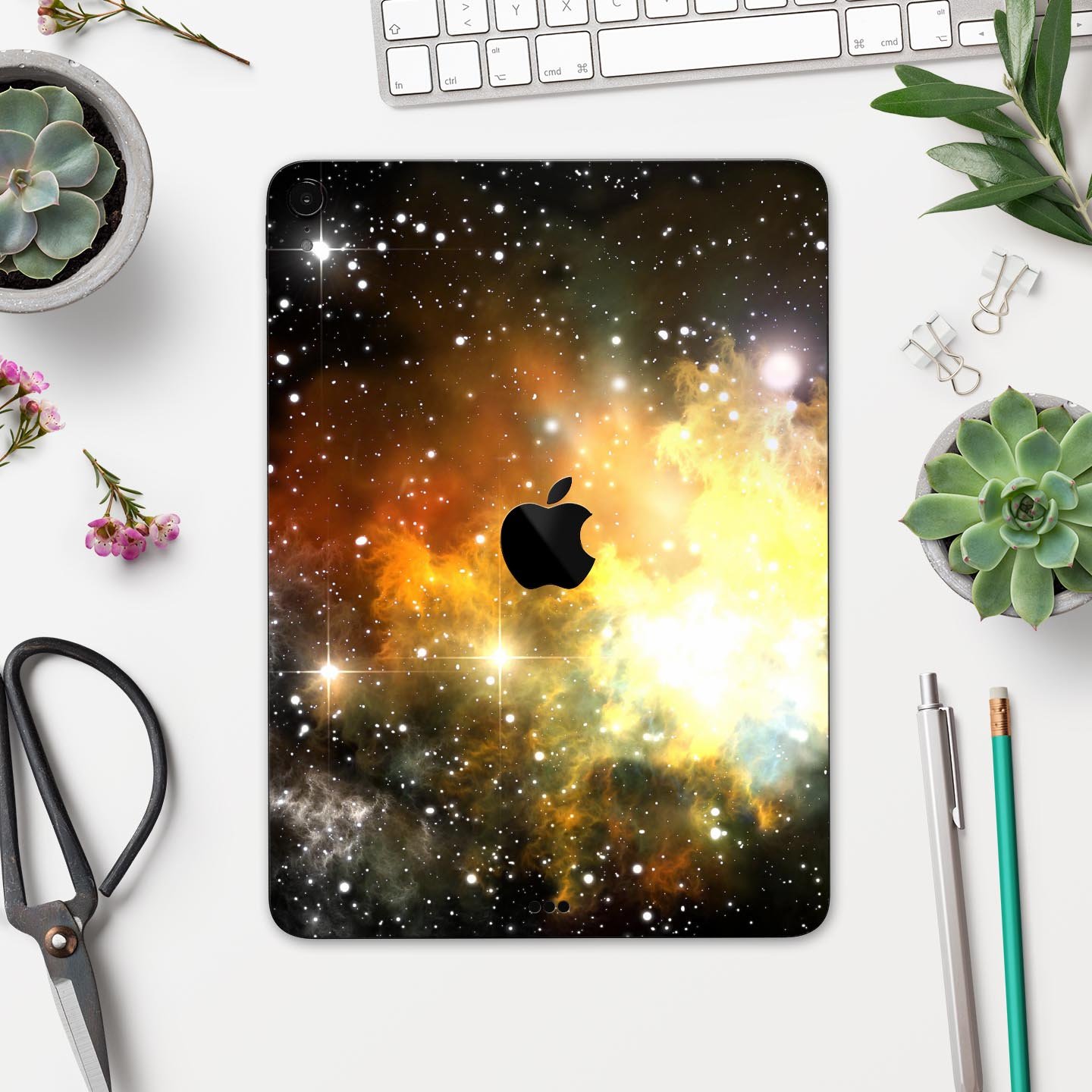 Glowing Gold & Black Nebula skin decal for Apple iPad, showcasing vibrant colors and a sleek design.