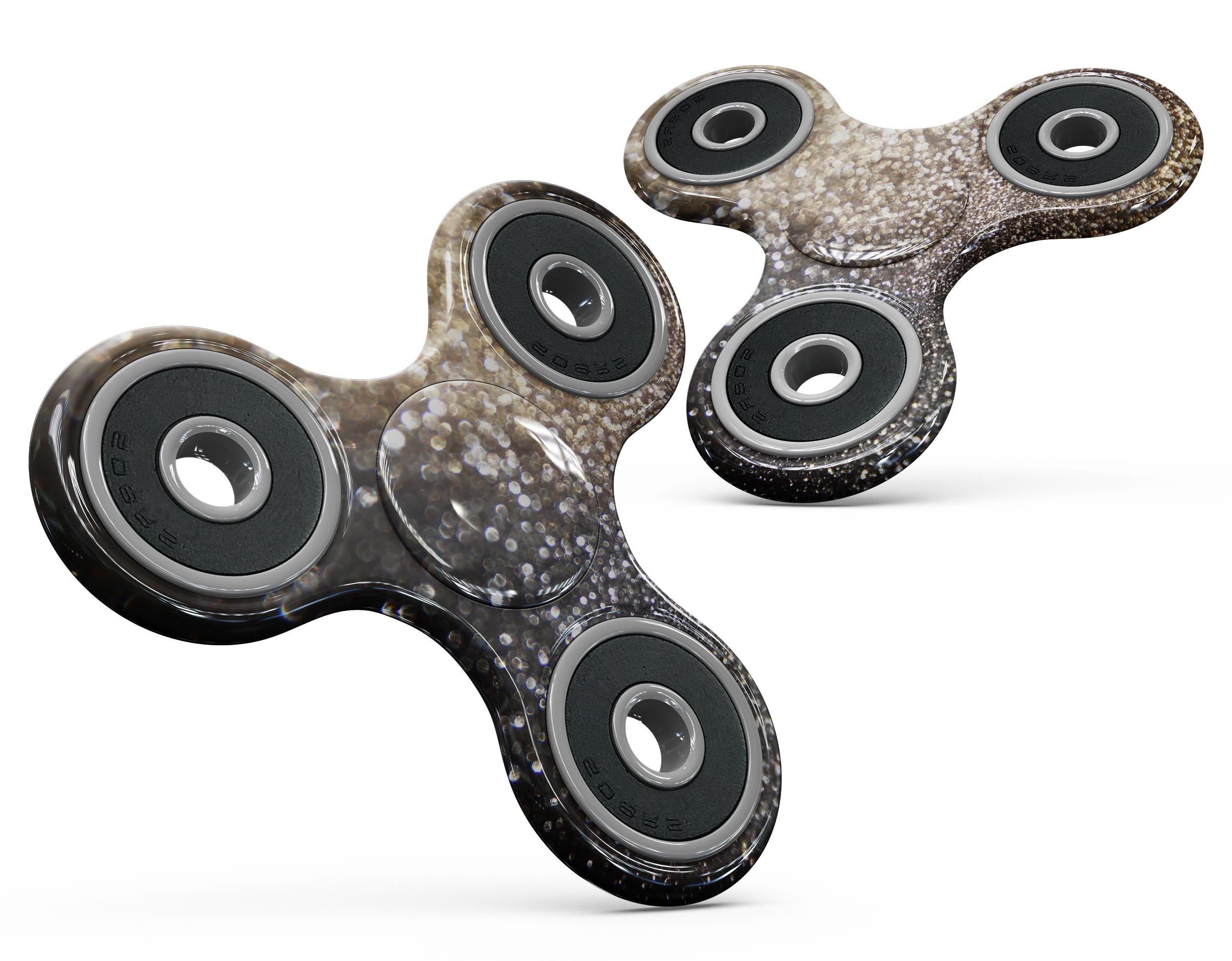 Gold and Black Unfocused Glimmering RainFall fidget spinner skin showcasing its vibrant design and premium vinyl material.