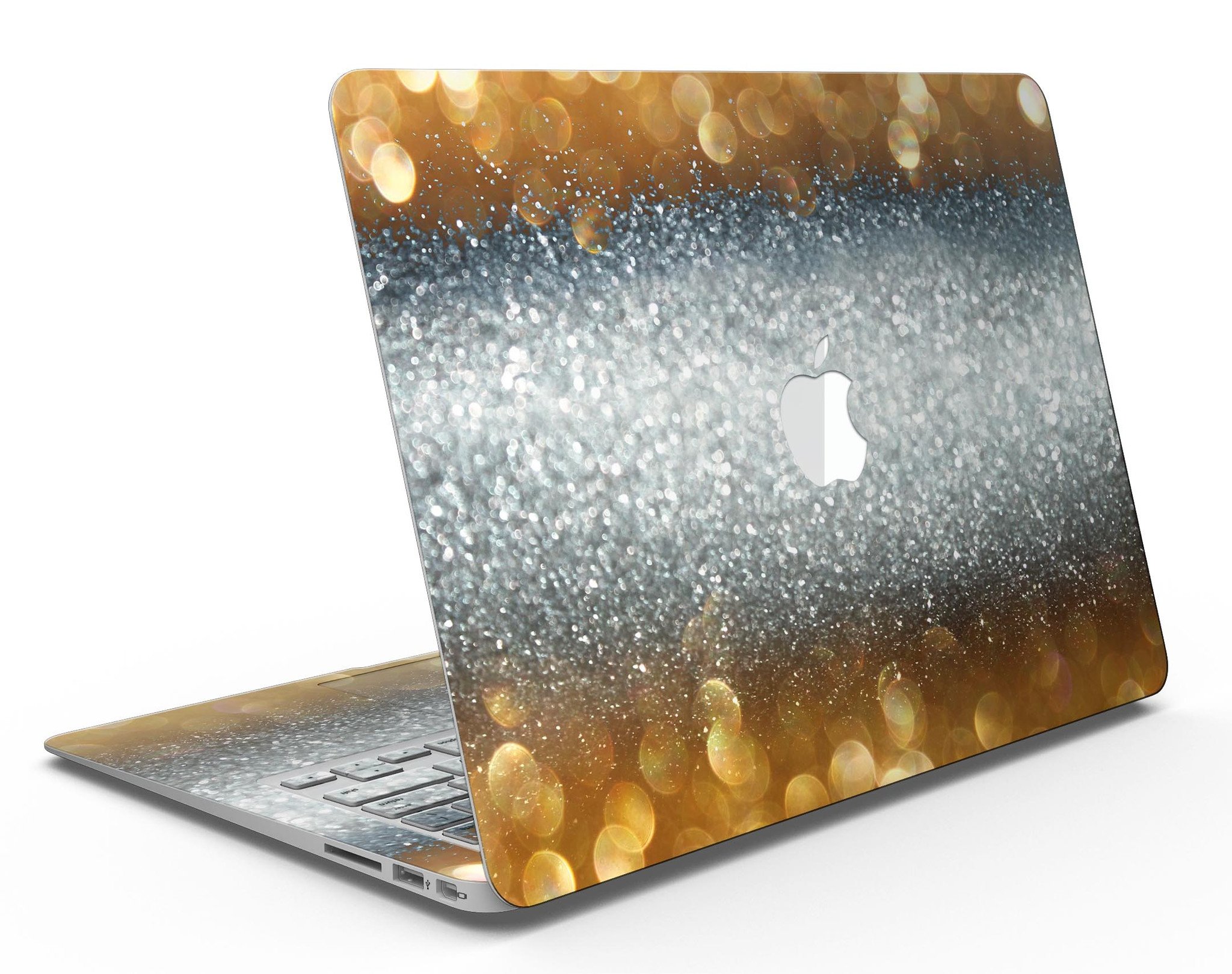 Gold and Silver Unfocused Orbs of Glowing Light skin kit applied to a MacBook Air, showcasing its vibrant design and sleek finish.