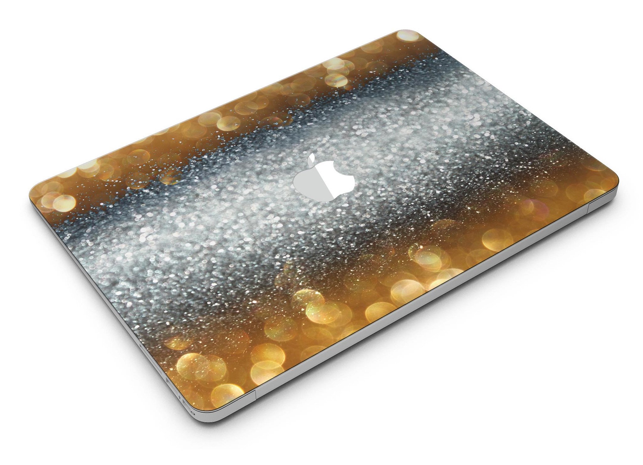 Gold and Silver Unfocused Orbs of Glowing Light skin kit applied to a MacBook Air, showcasing its vibrant design and sleek finish.