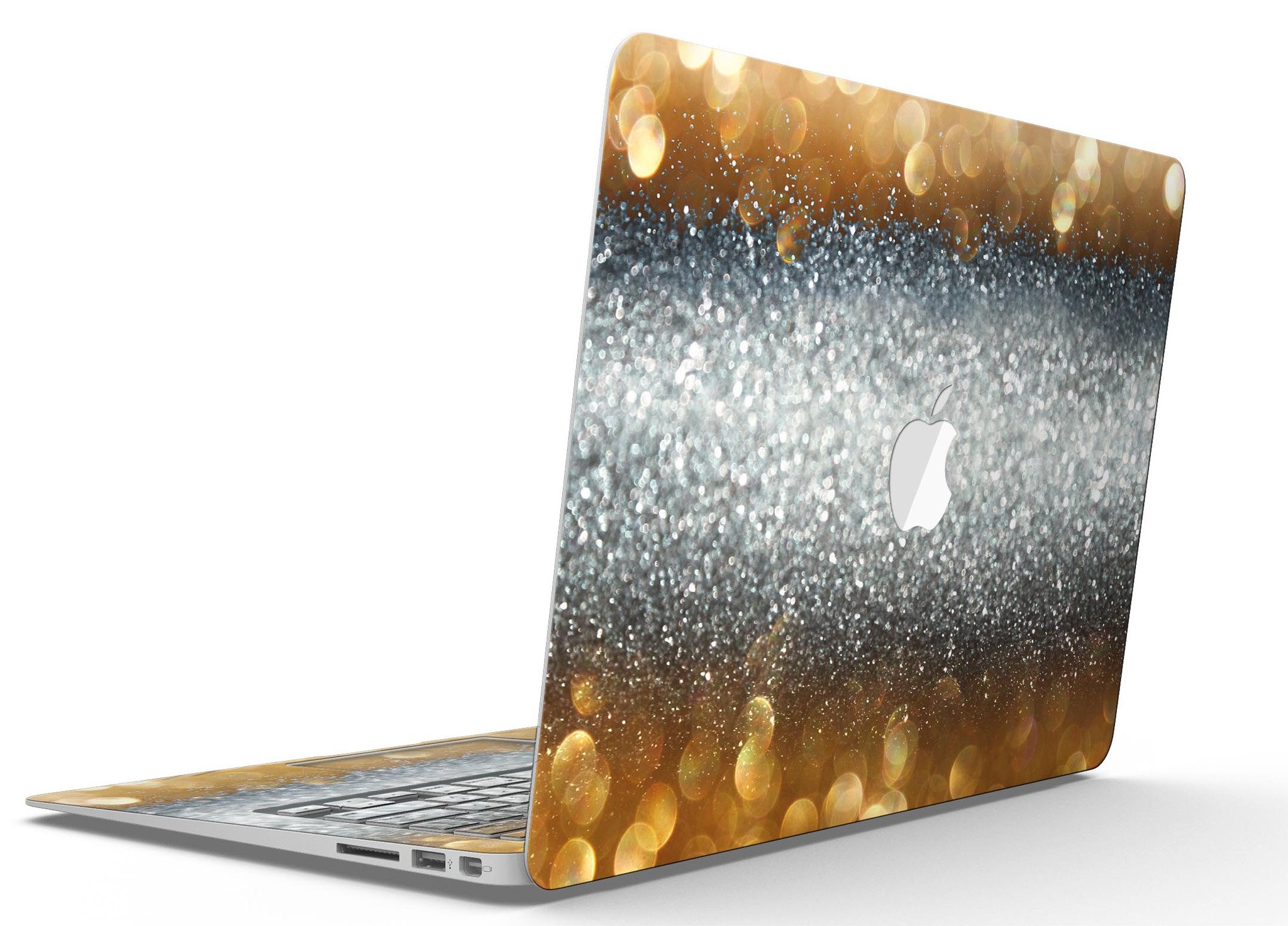 Gold and Silver Unfocused Orbs of Glowing Light skin kit applied to a MacBook Air, showcasing its vibrant design and sleek finish.