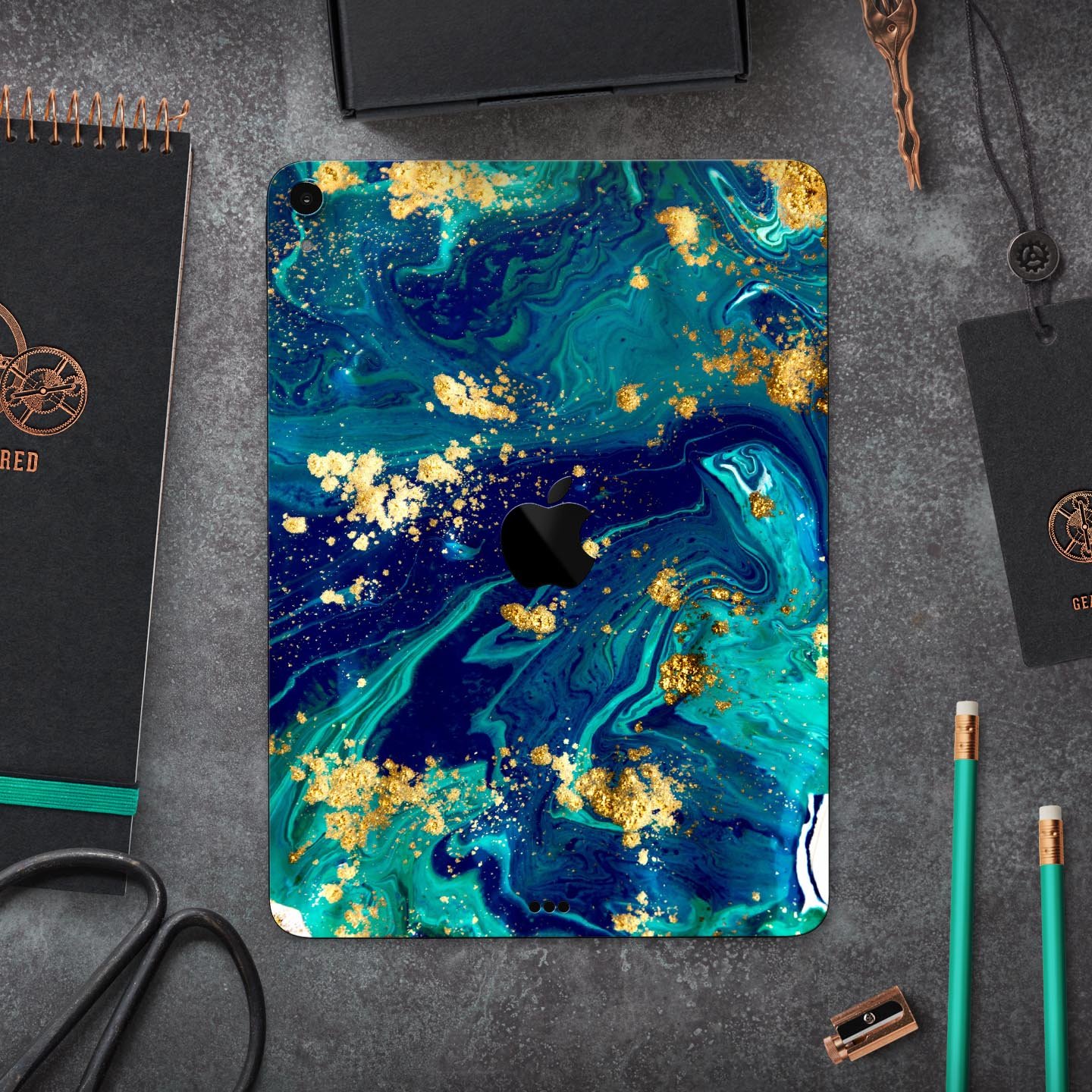 Gold Flaked Teal Oil skin decal for Apple iPad Pro, showcasing its elegant design and premium finish.