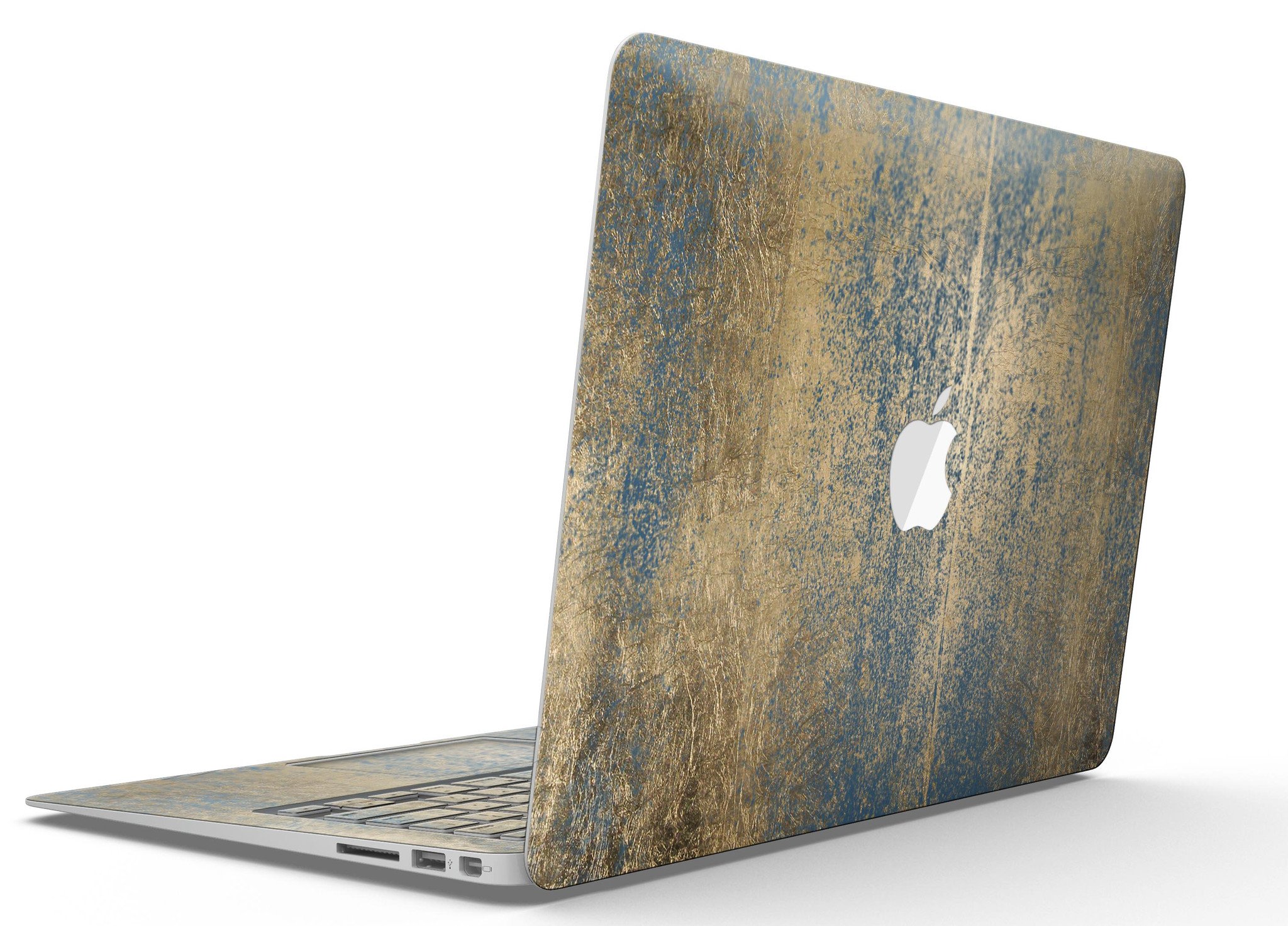 Gold Scratched Foil skin applied to a MacBook Air, showcasing its stylish design and premium finish.