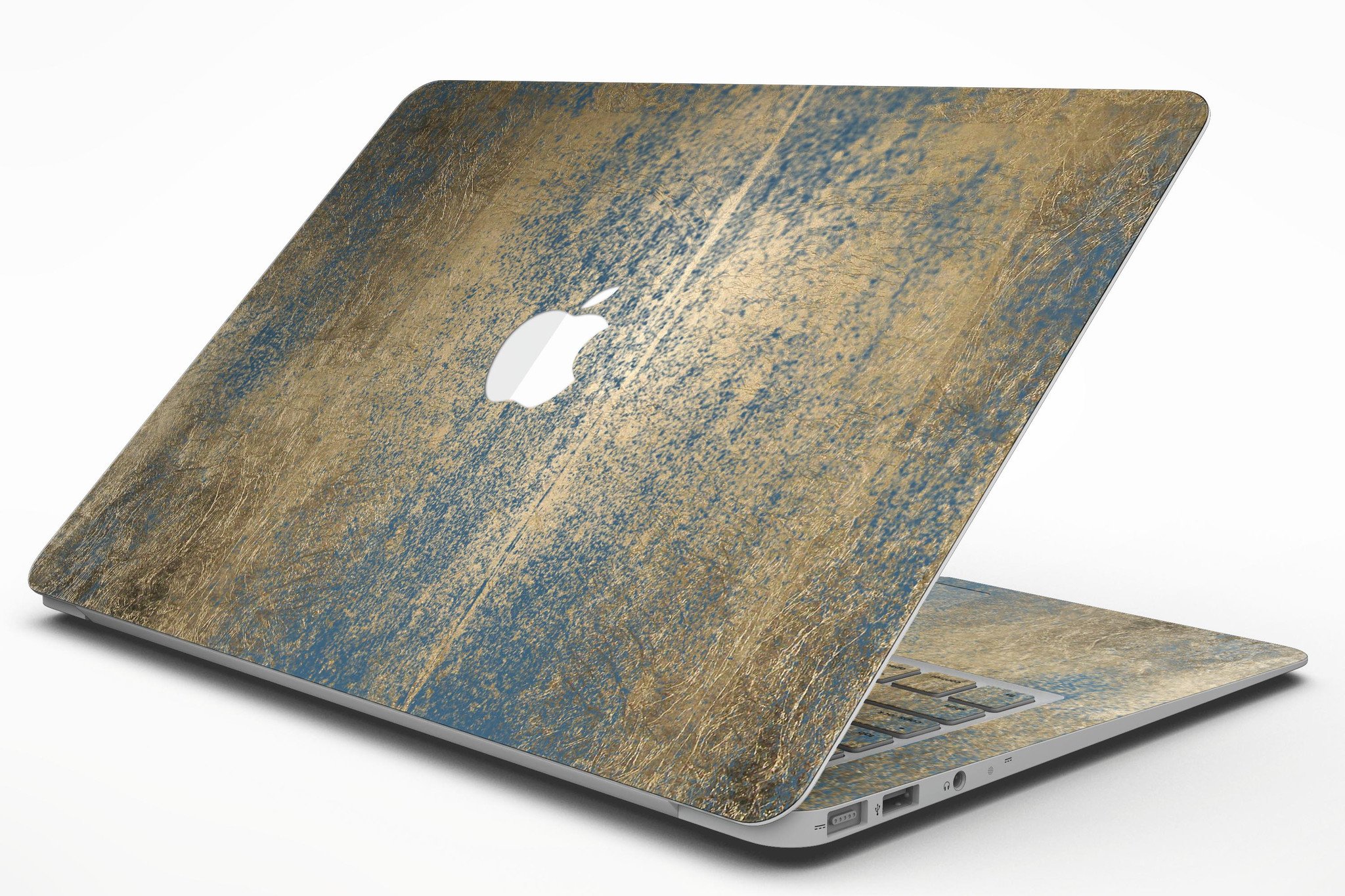 Gold Scratched Foil skin applied to a MacBook Air, showcasing its stylish design and premium finish.