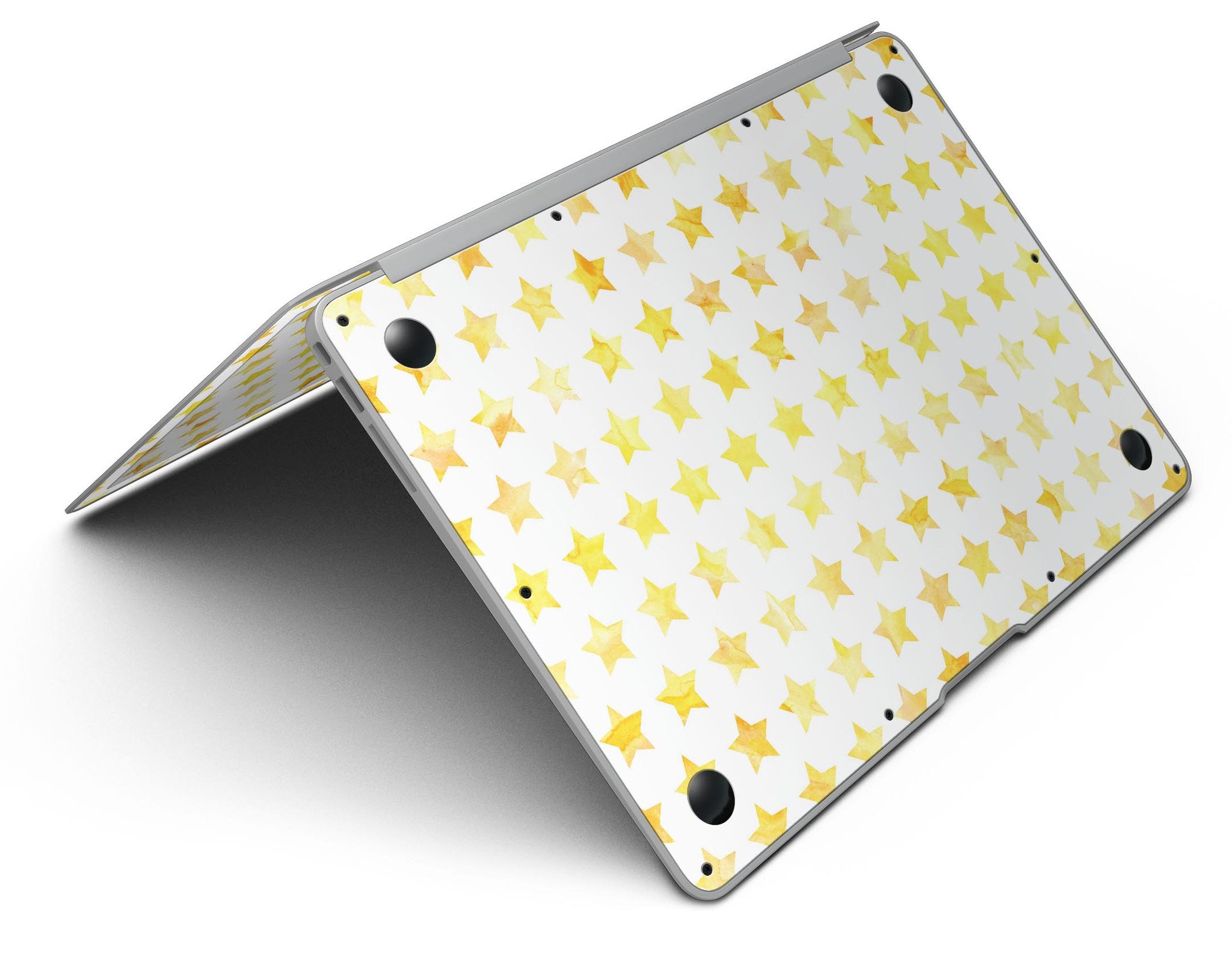 Gold Watercolor Stars MacBook Air Skin Kit showcasing a vibrant star design on a sleek laptop surface.