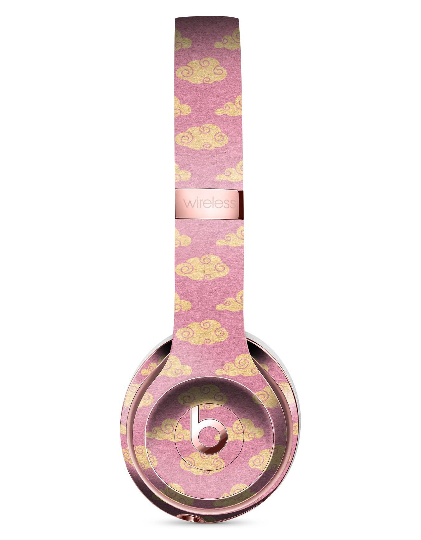 Golden Cartoon Clouds Skin Kit for Beats by Dre Solo 3 Wireless Headphones, featuring a playful design on a pink background.