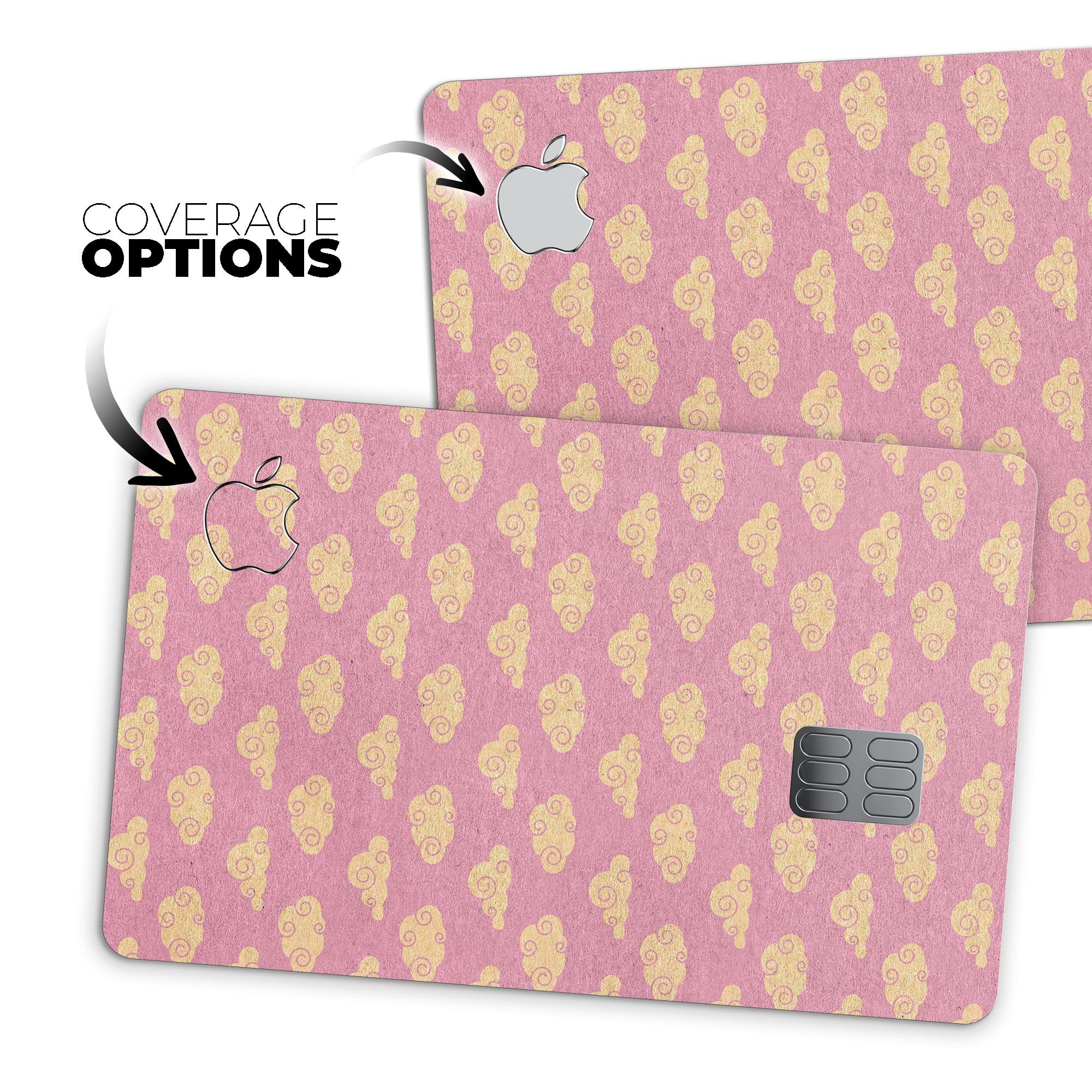 Golden Cartoon Clouds design on a pink background, showcasing a premium protective decal skin for Apple Card.