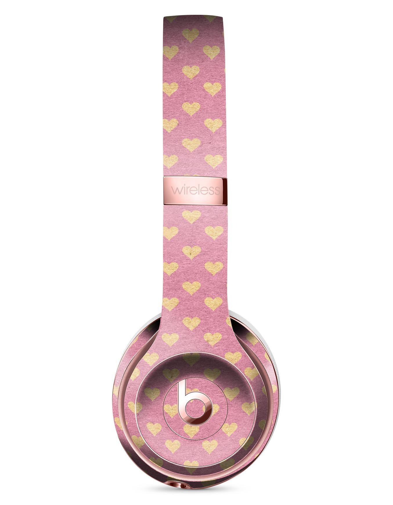 Golden Micro Hearts Skin Kit for Beats by Dre Solo 3 Wireless Headphones, featuring a pink background and stylish heart design.