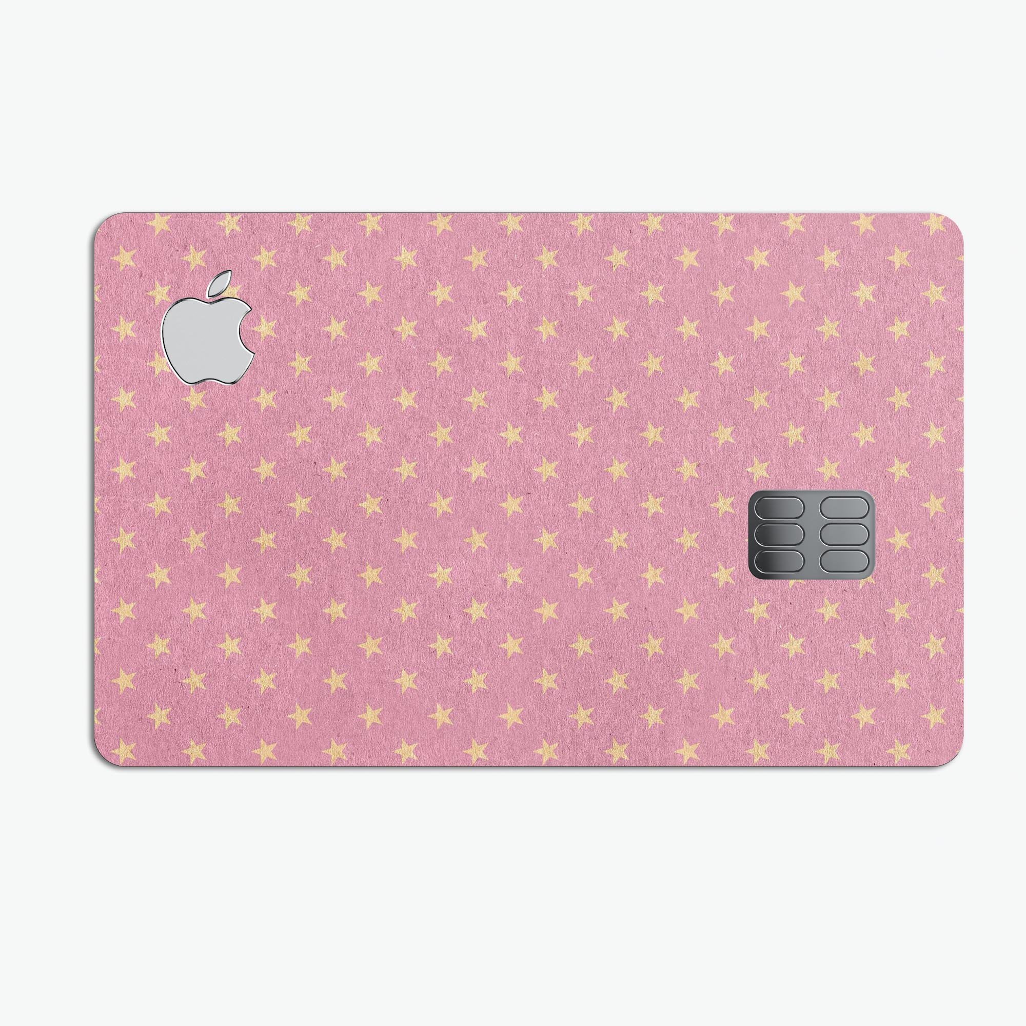 Golden Micro Stars skin kit for Apple Card, featuring a pink background and premium vinyl material for protection.