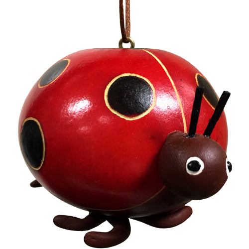 Hand-carved gourd ornament shaped like a ladybug with ceramic accents, showcasing intricate designs and vibrant colors.