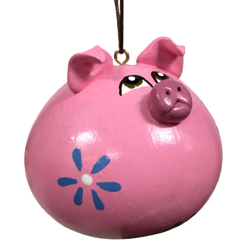 Hand-carved gourd pig ornament with ceramic accents, showcasing a whimsical design and unique craftsmanship.