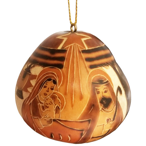 Hand-carved gourd nativity ornament featuring Mary, Joseph, and an angel, beautifully detailed and unique in shape.