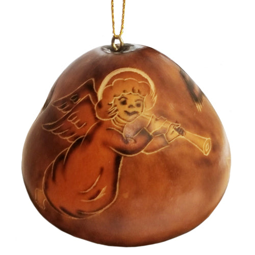 Hand-carved gourd nativity ornament featuring Mary, Joseph, and an angel, beautifully detailed and unique in shape.