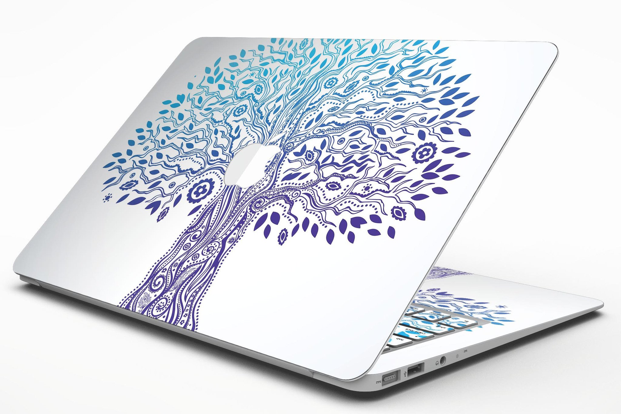 Gradiated Tree of Life MacBook Air Skin Kit showcasing vibrant colors and sleek design on a MacBook Air.