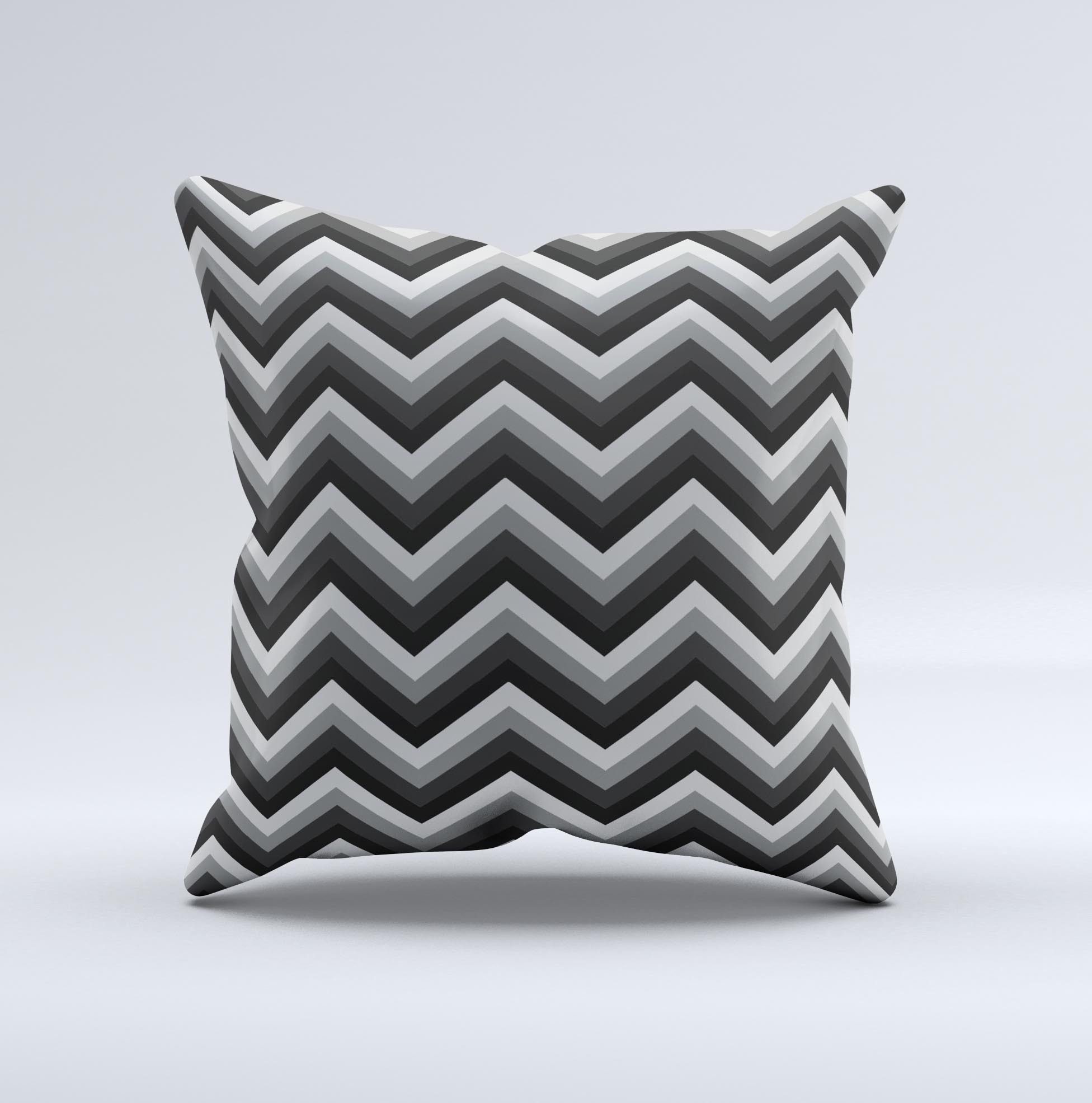 Gray toned decorative throw pillow featuring a layered chevron pattern, handcrafted in Virginia with high-quality materials.