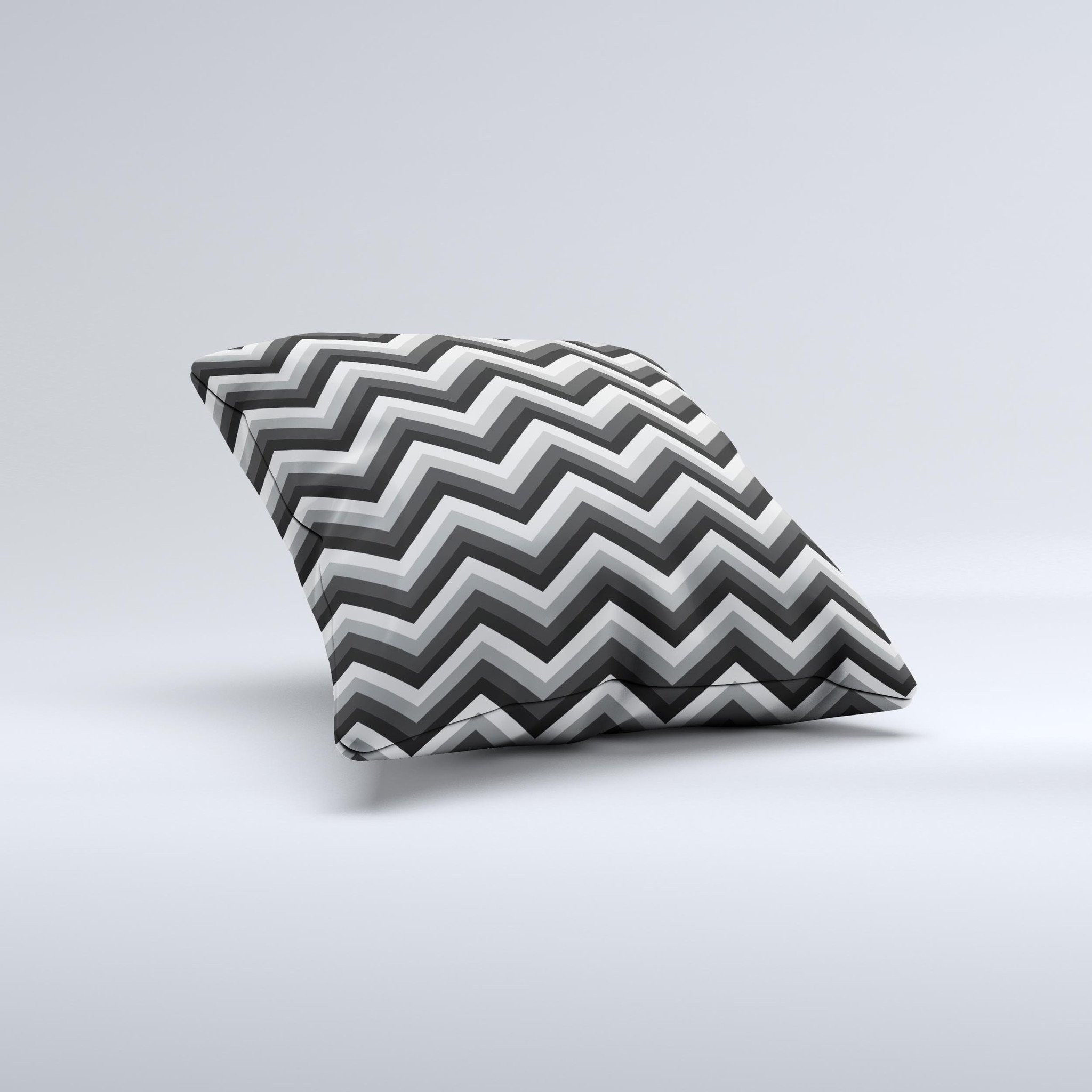 Gray toned decorative throw pillow featuring a layered chevron pattern, handcrafted in Virginia with high-quality materials.