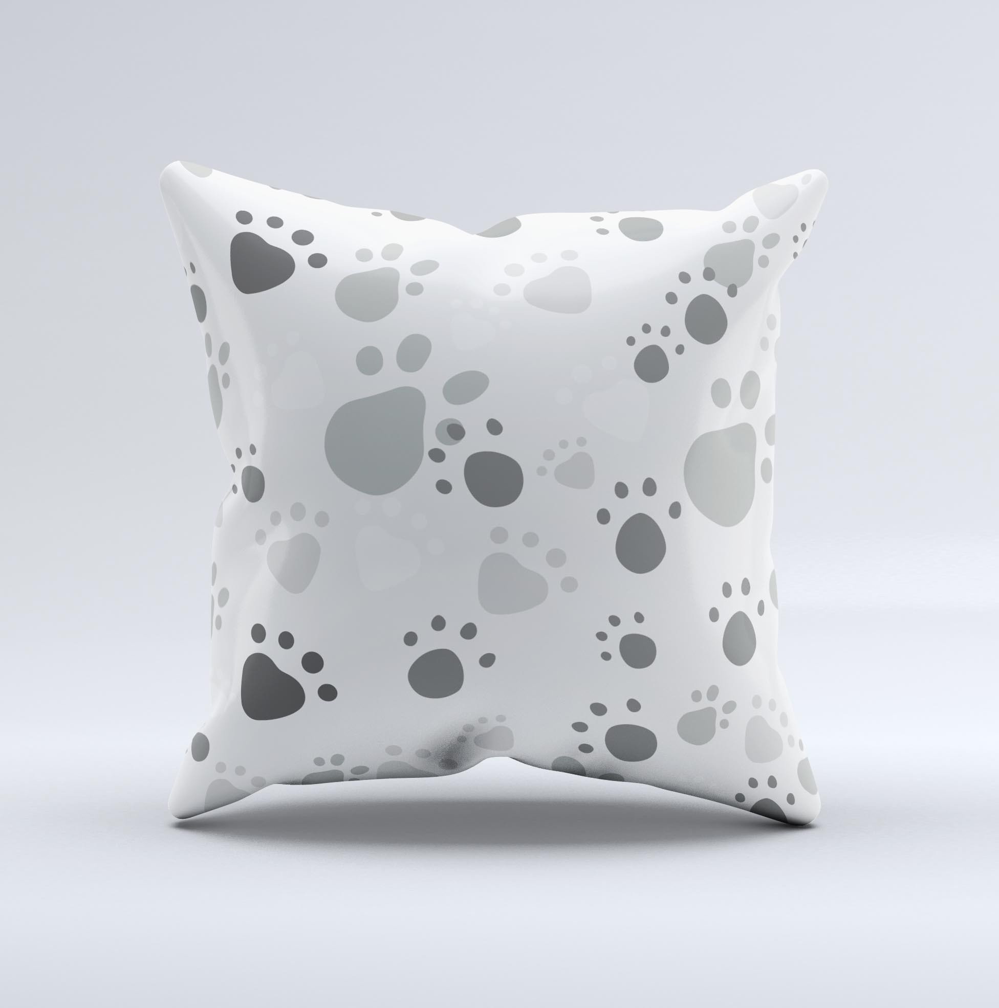 Gray and white decorative throw pillow featuring large paw prints, handcrafted in Virginia with high-quality materials.